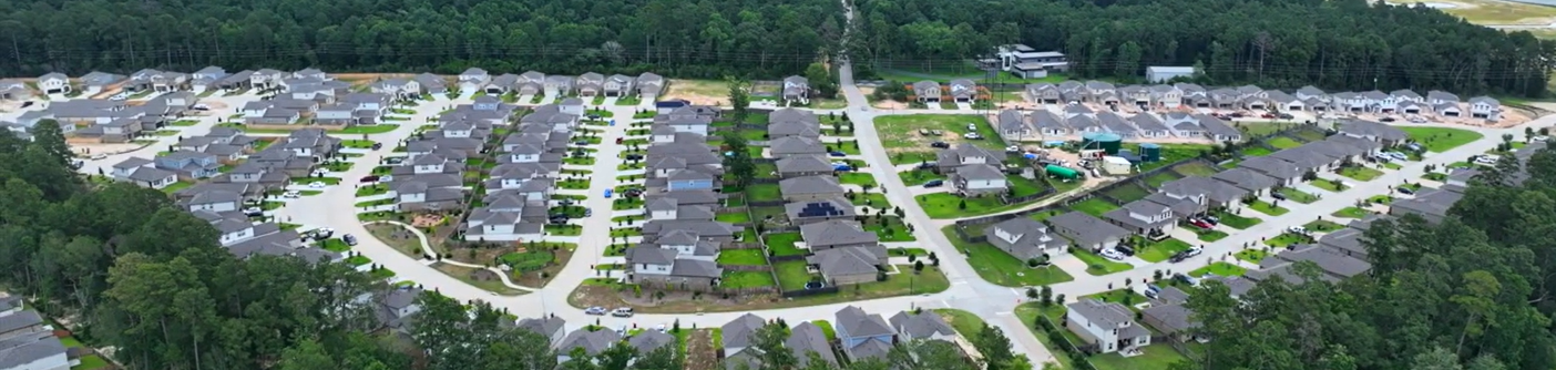 A large area with many buildings and trees around it.