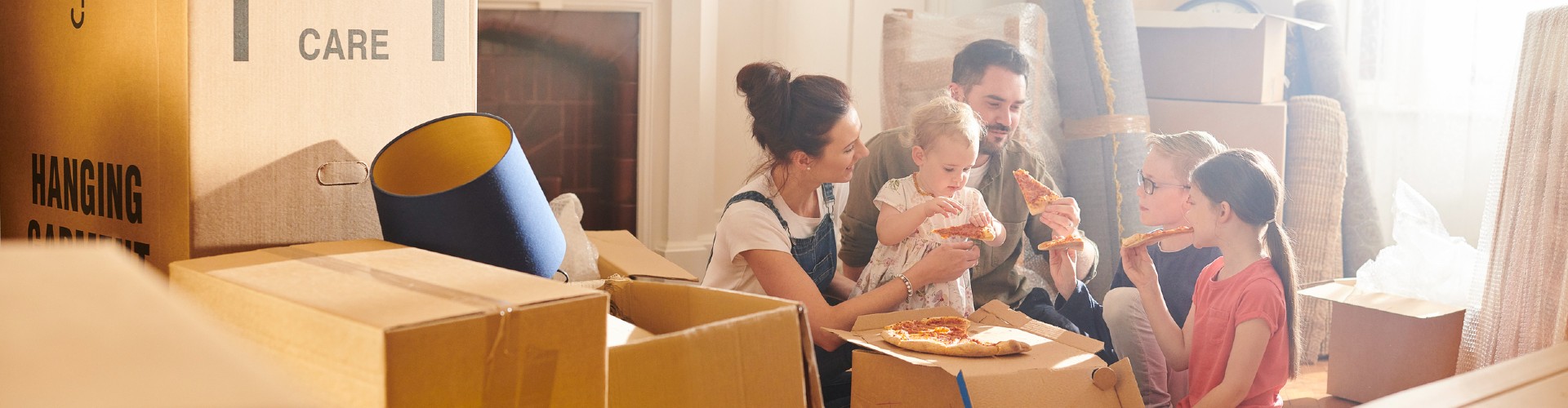 A group of people eating pizza.