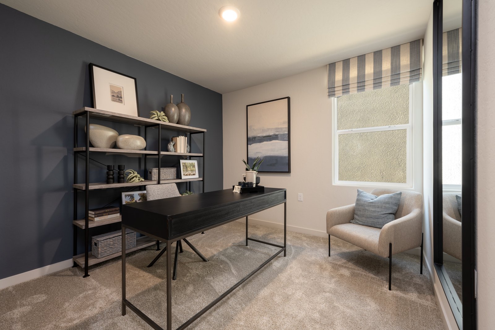 A room with a table and chairs.