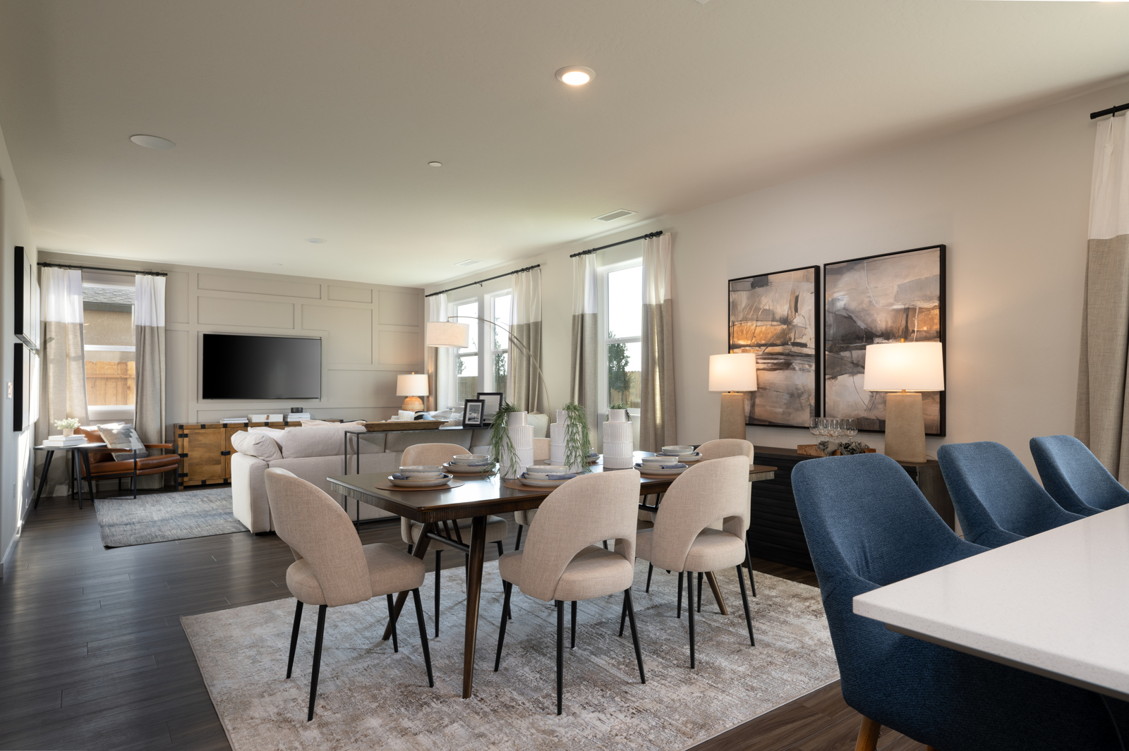 A large dining room with a large table and chairs.