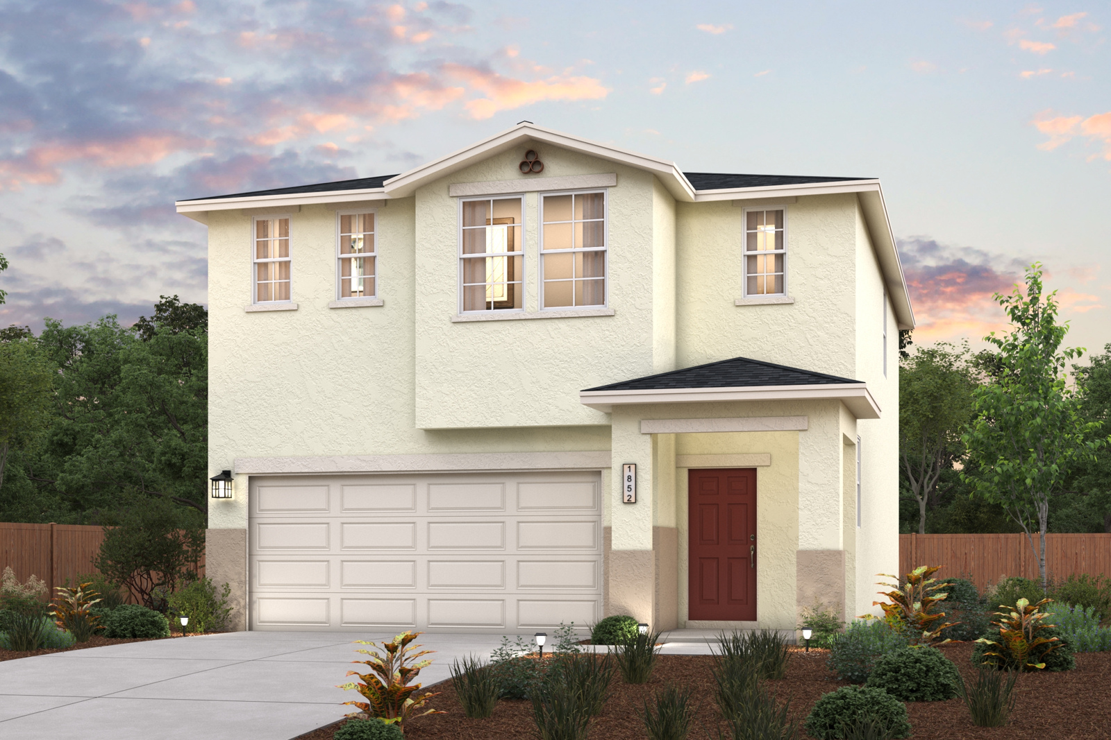 A white house with a garage.