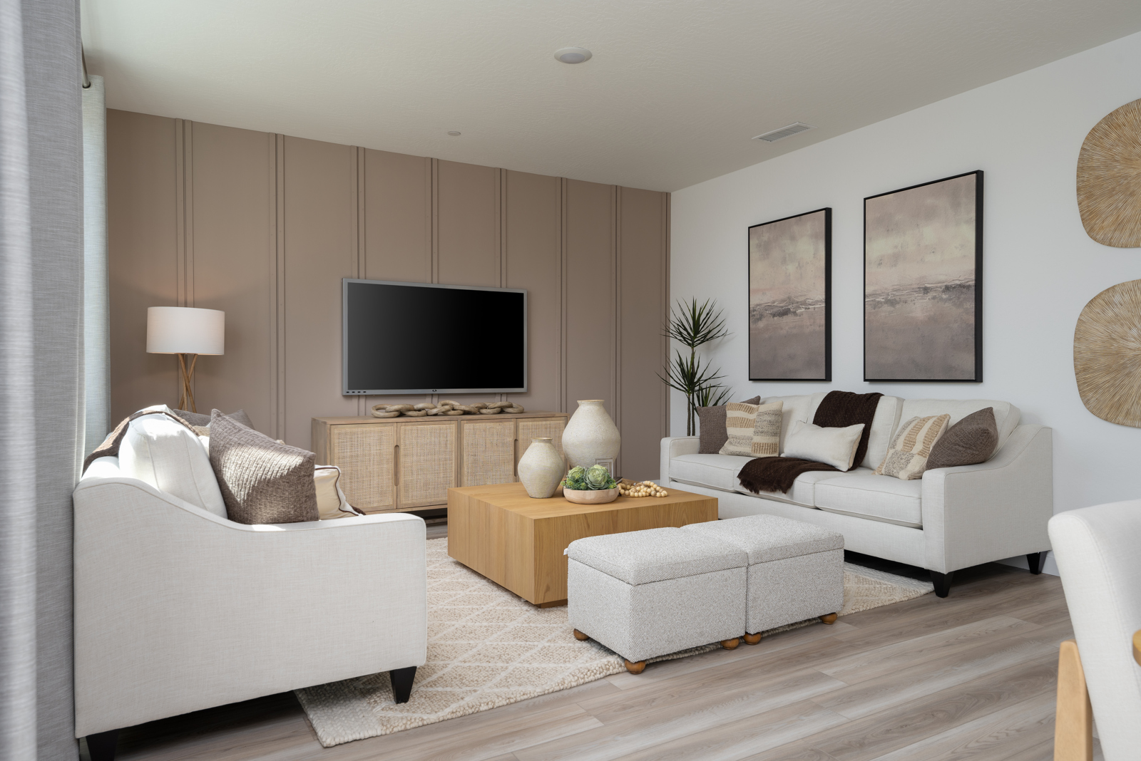 A living room with a tv and couches.