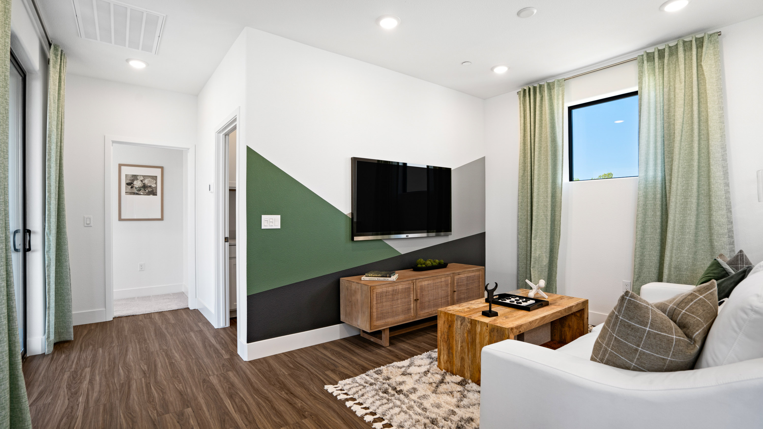 A living room with a tv and couches.