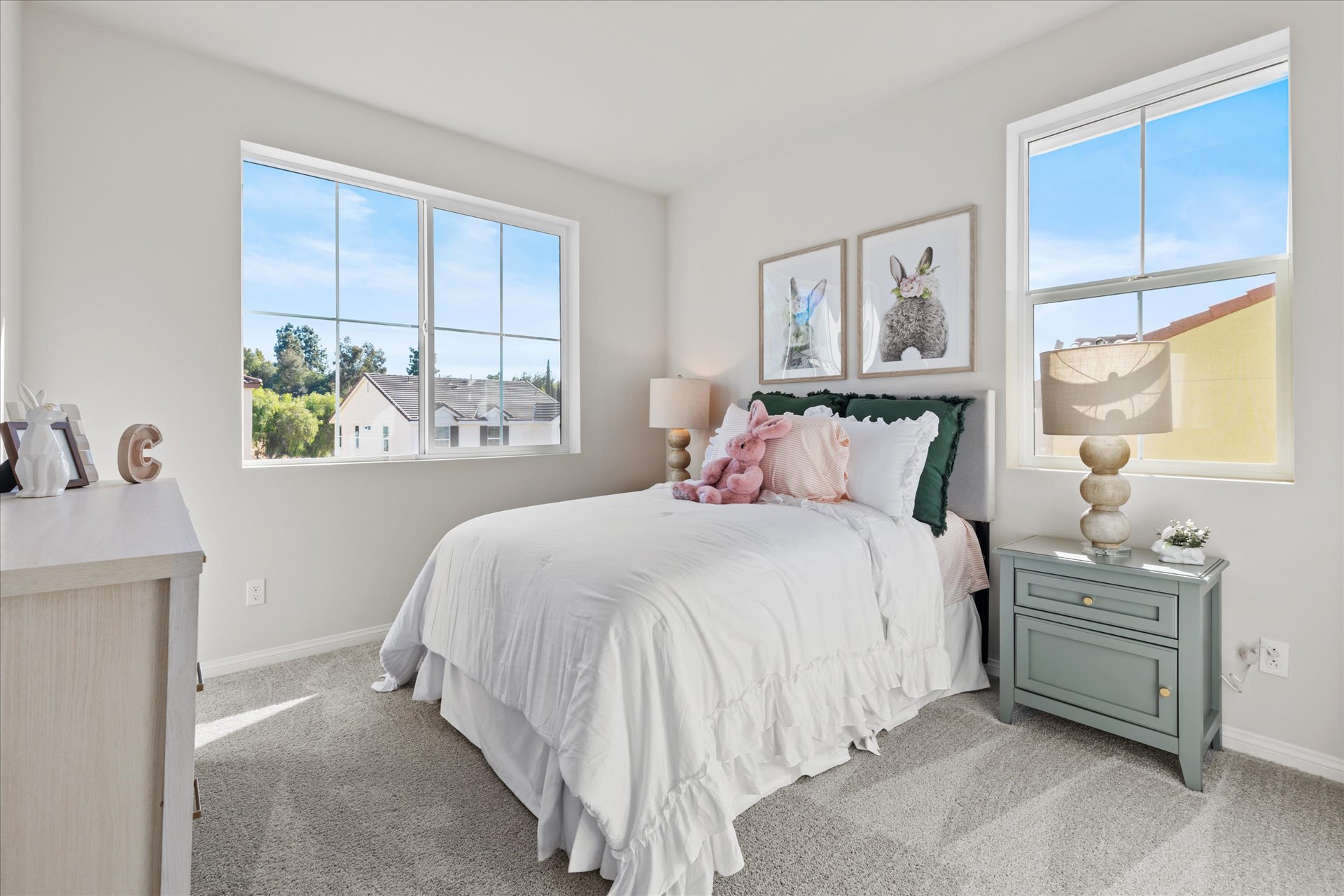 A bedroom with a bed and a window.