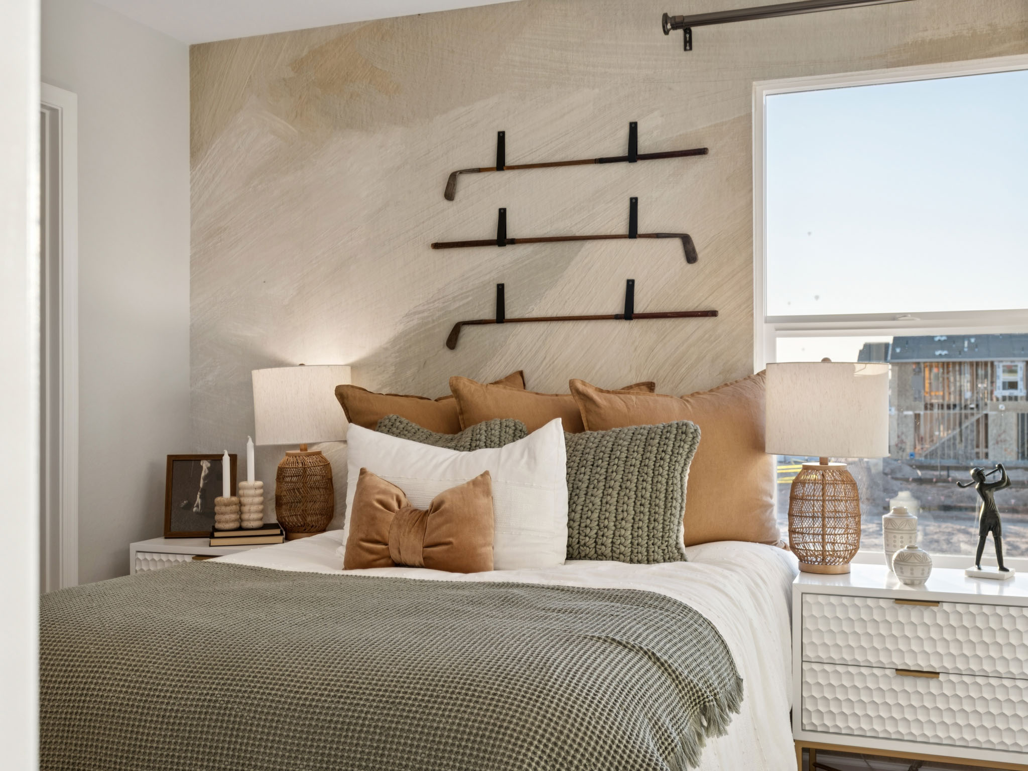 A bed with a large headboard.