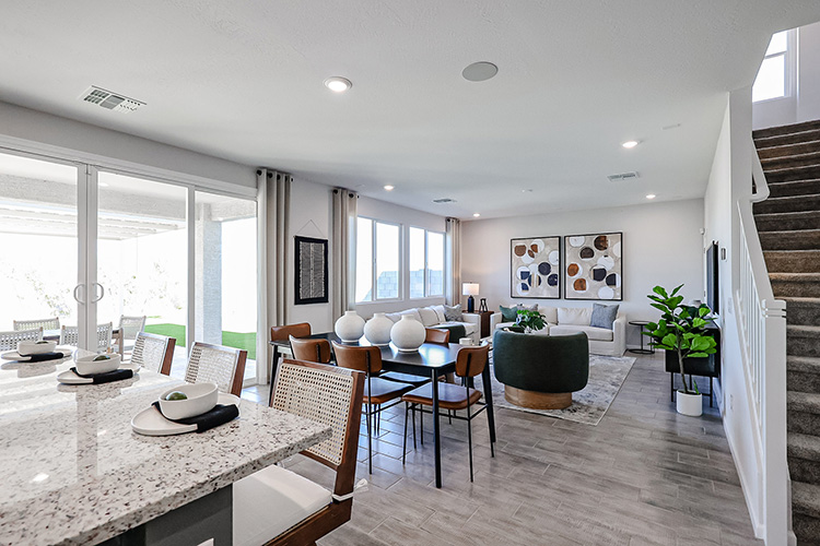 A room with a table and chairs.