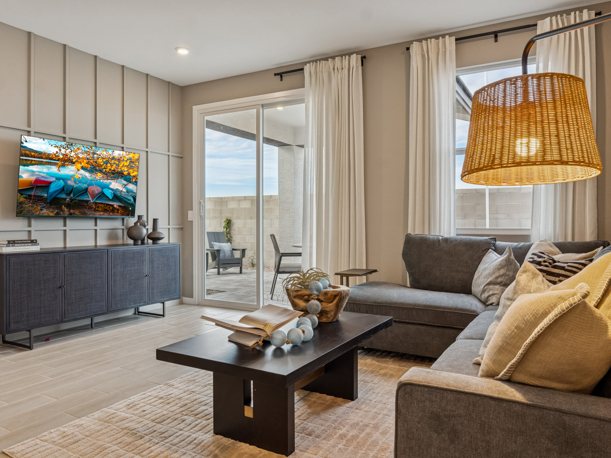 A living room with a large television.