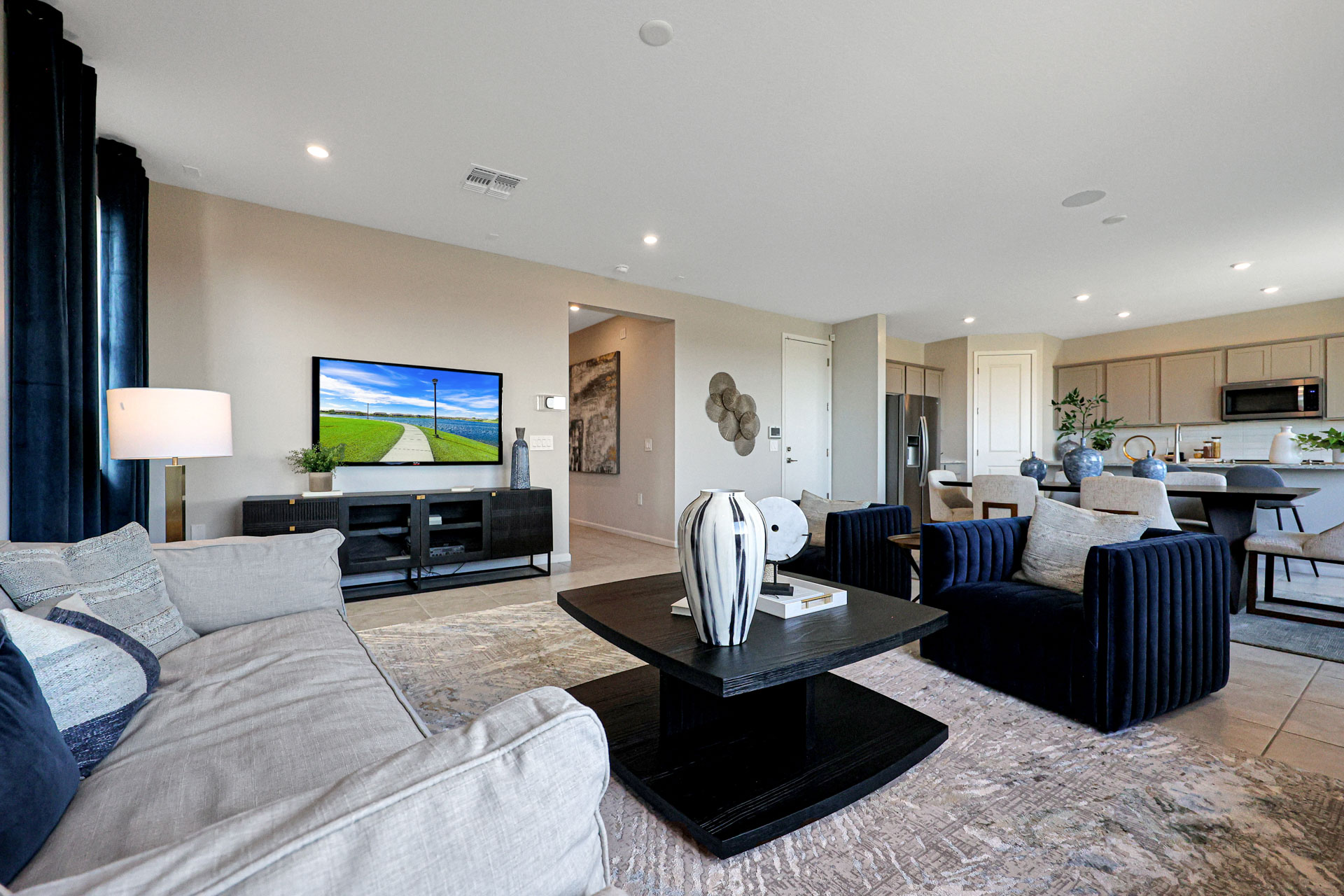 A living room with a tv and couches.