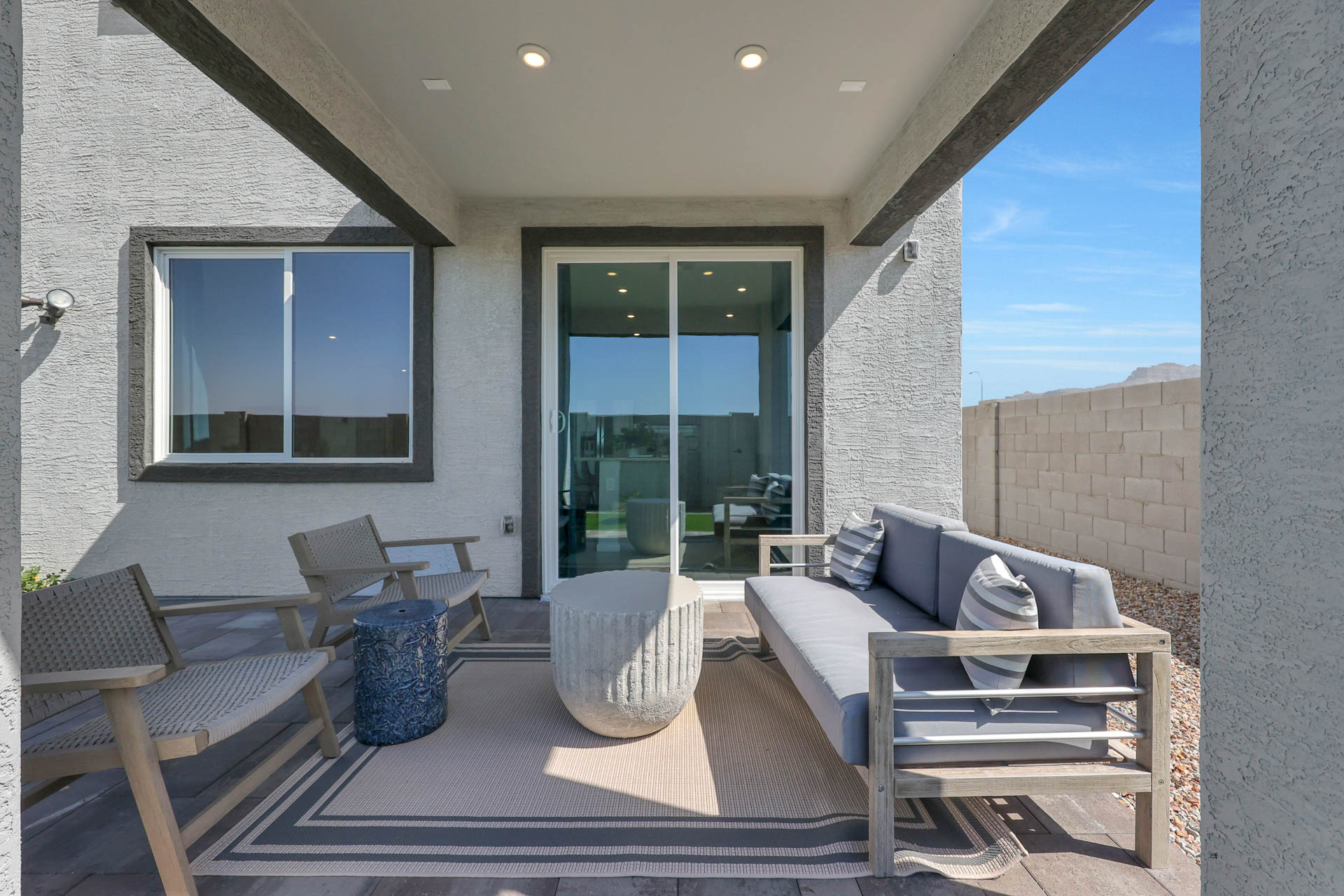 A living room with a large glass door.