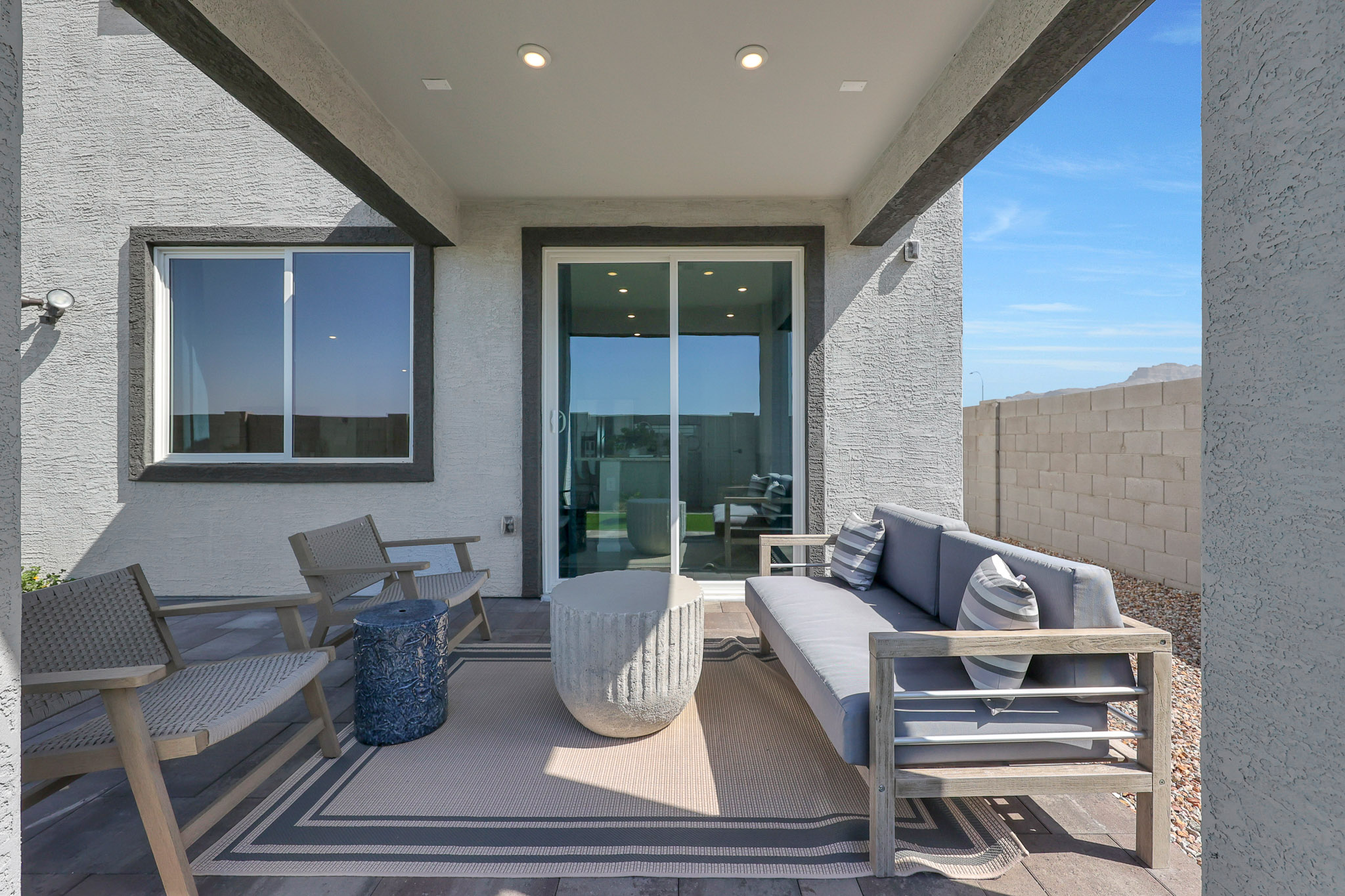 A living room with a couch and chairs.