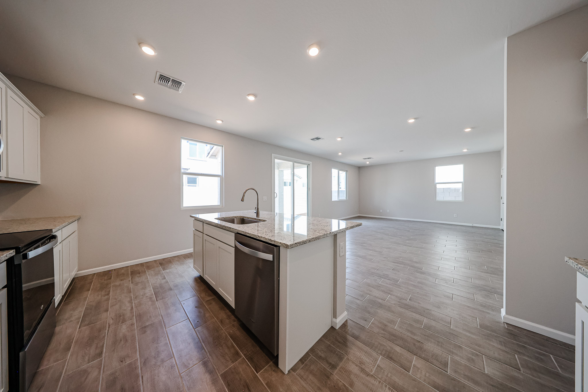 A kitchen with wooden floors.