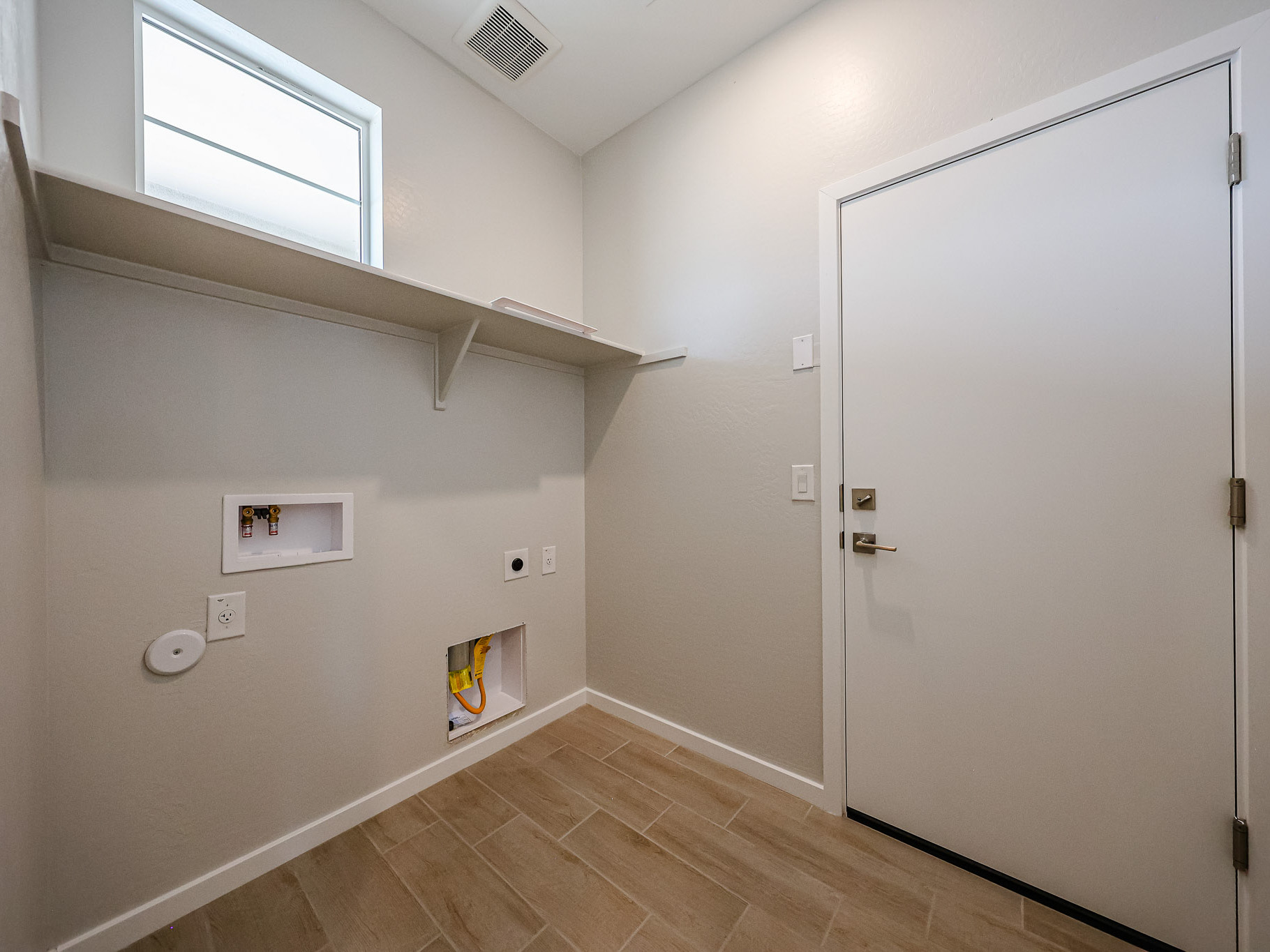 A room with a door and a window.