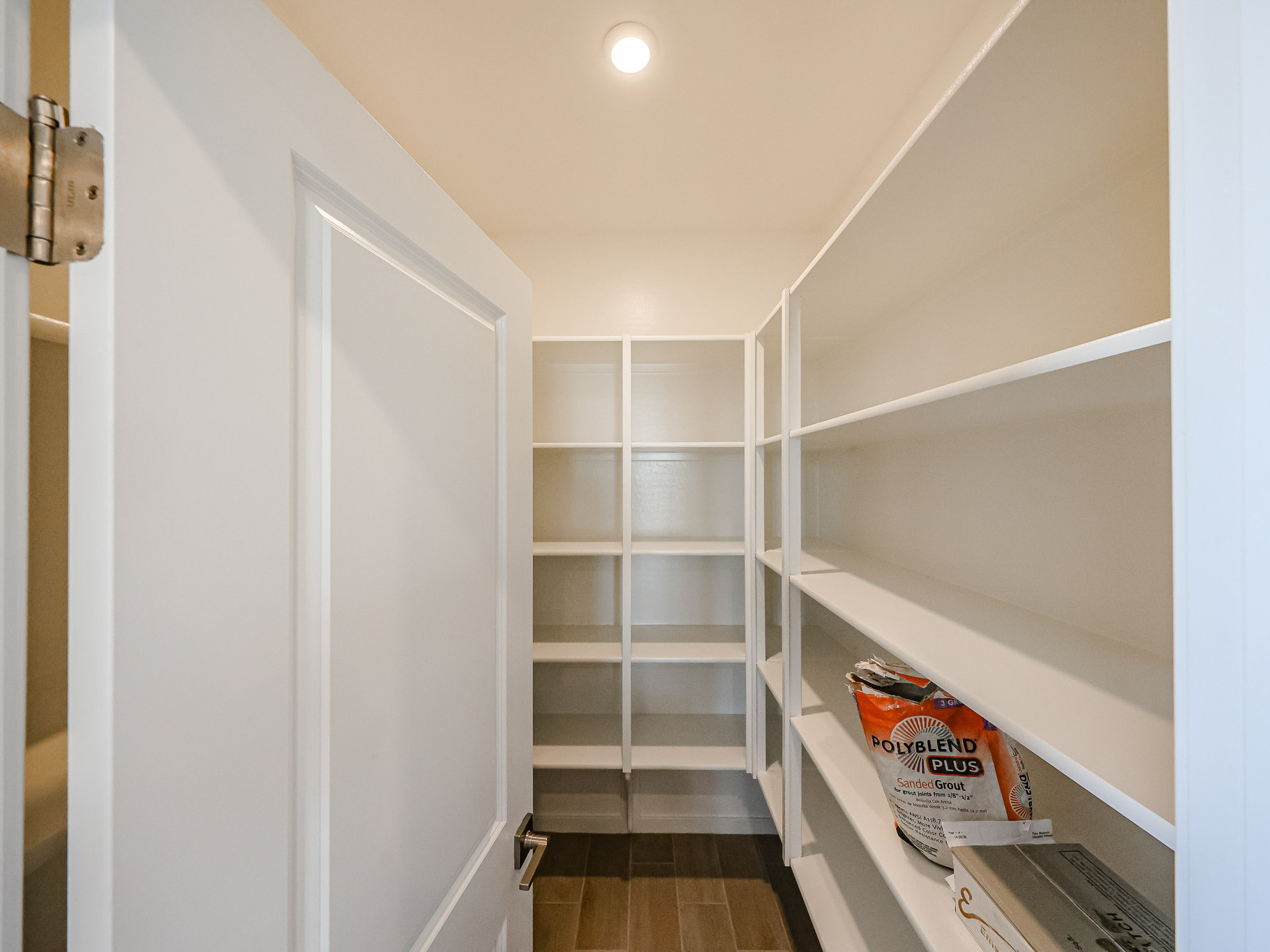 A white closet with a bag.