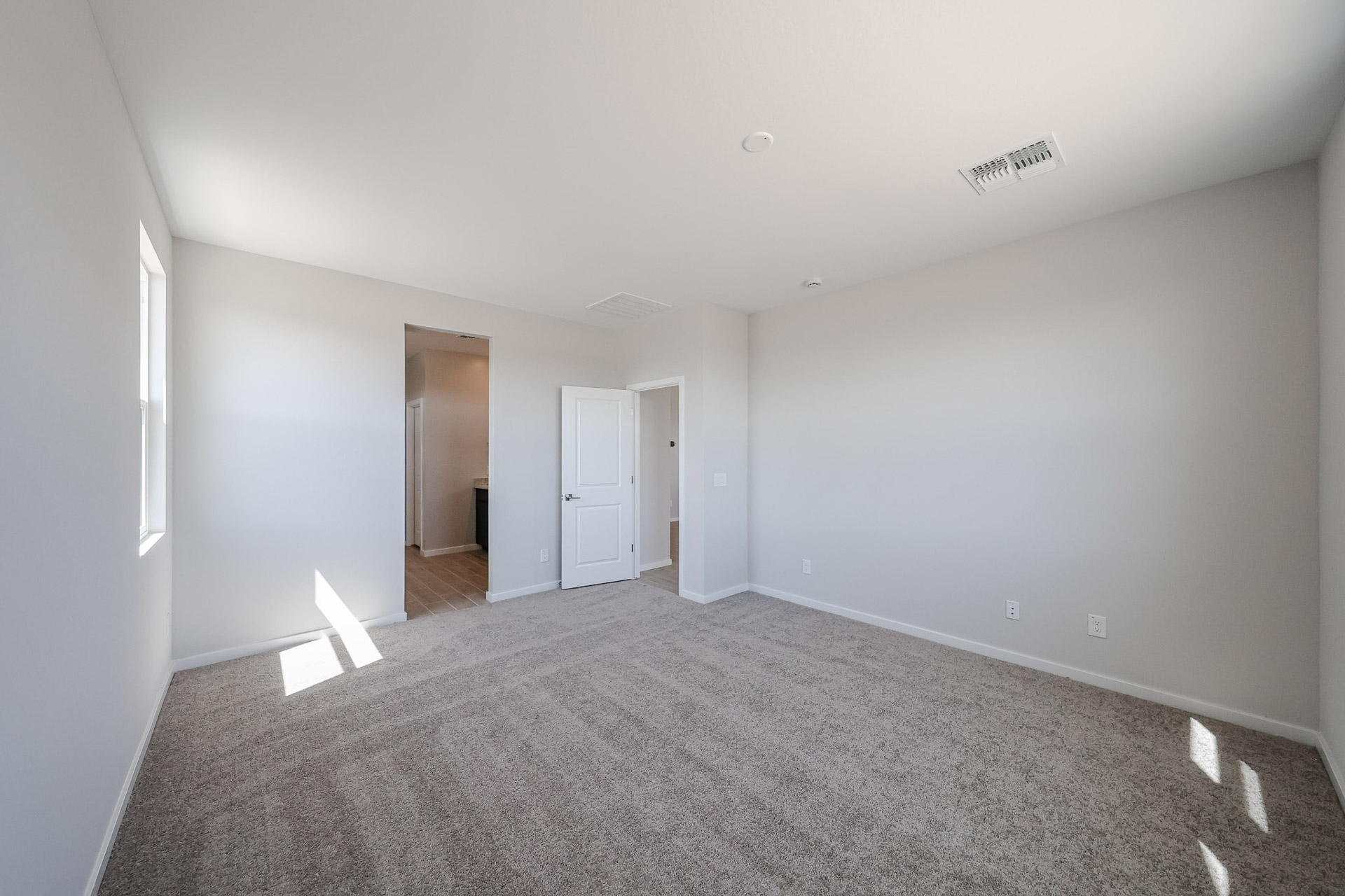 A hallway with white walls.
