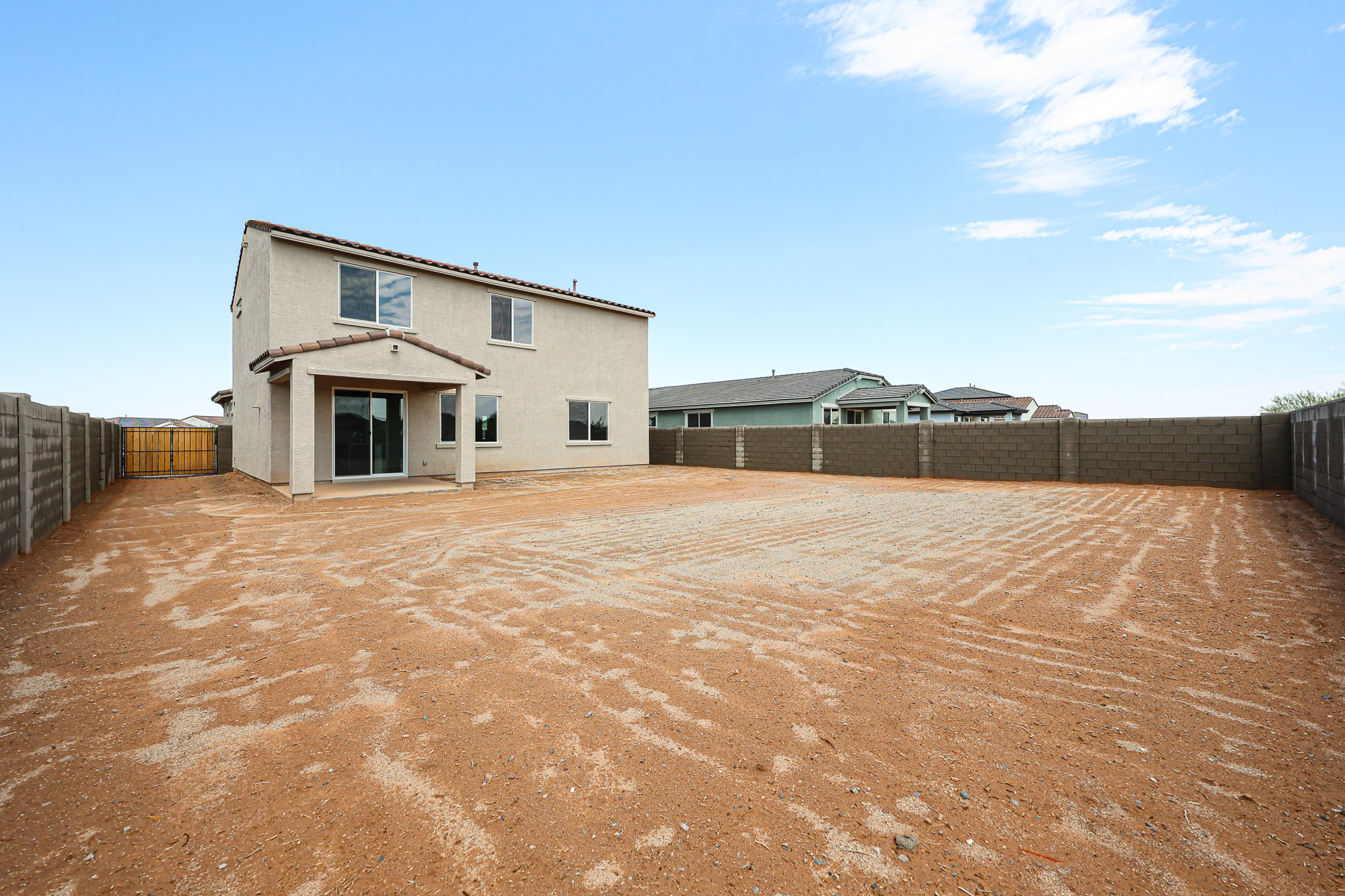 A house in a dirt field.