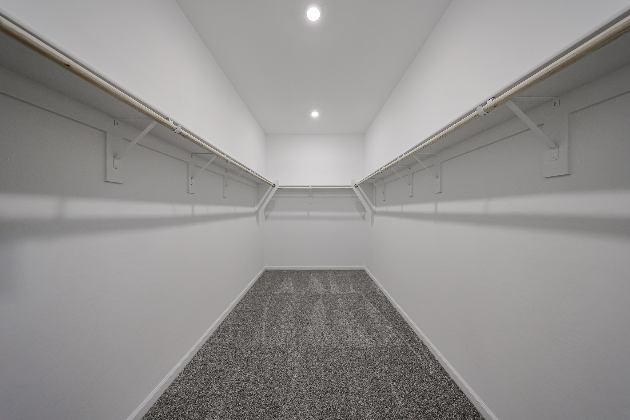 A hallway with white walls.