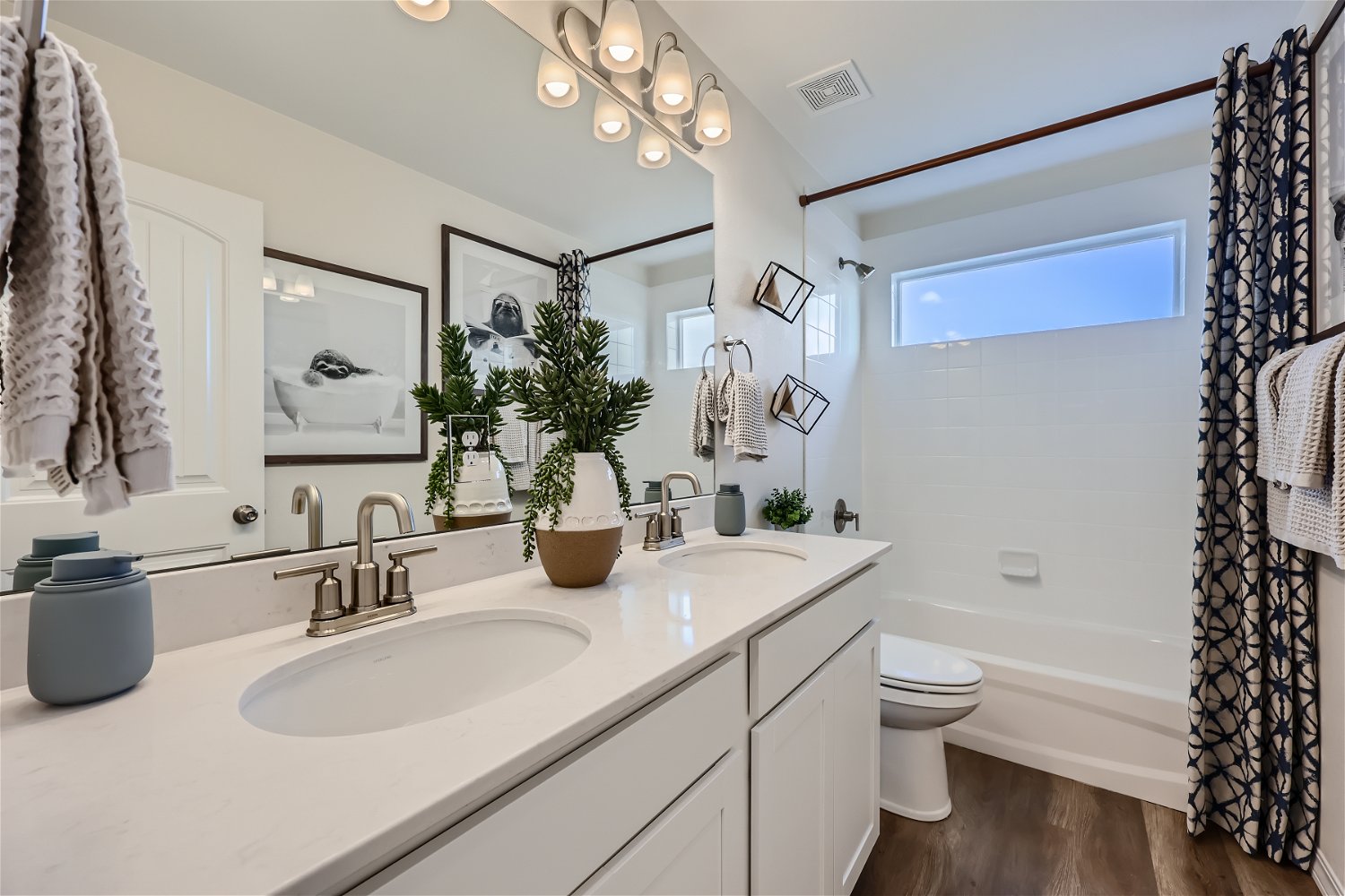 A bathroom with a large mirror.