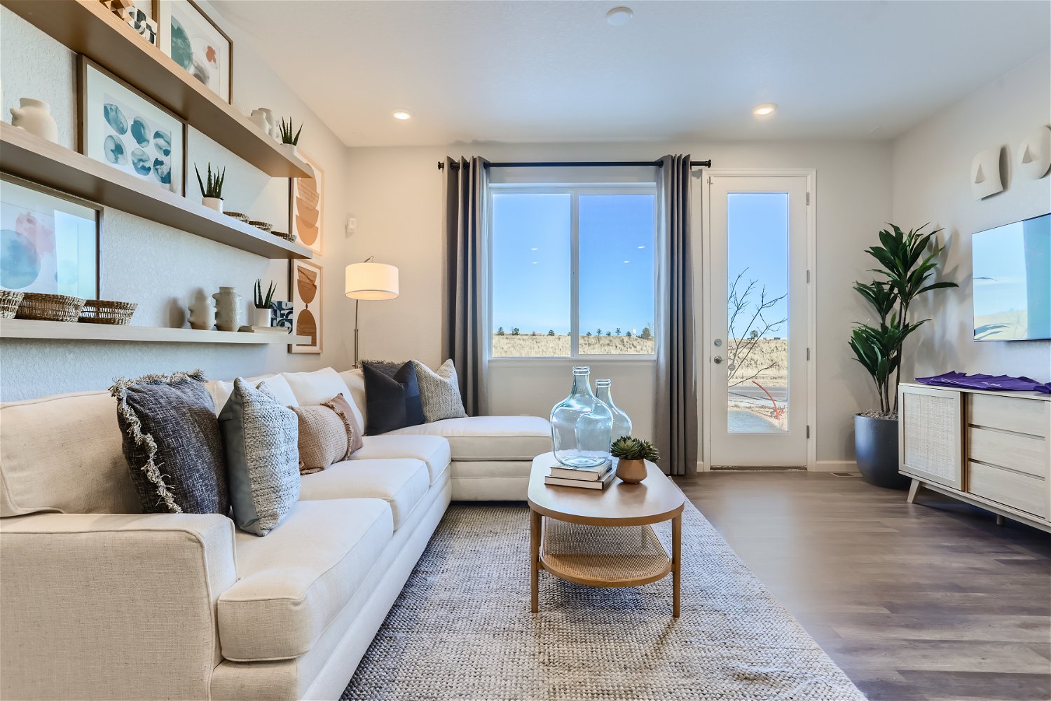 A living room with a large window.