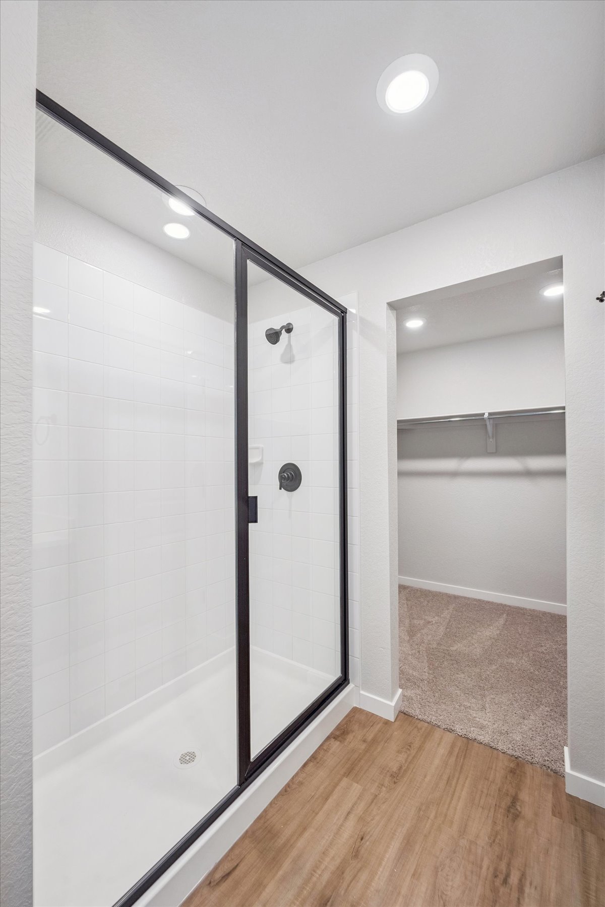 A shower unit in a bathroom.