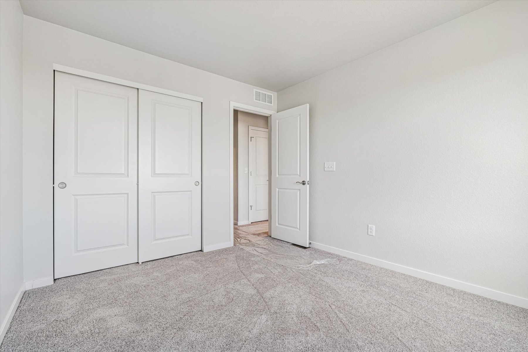 A room with white doors.