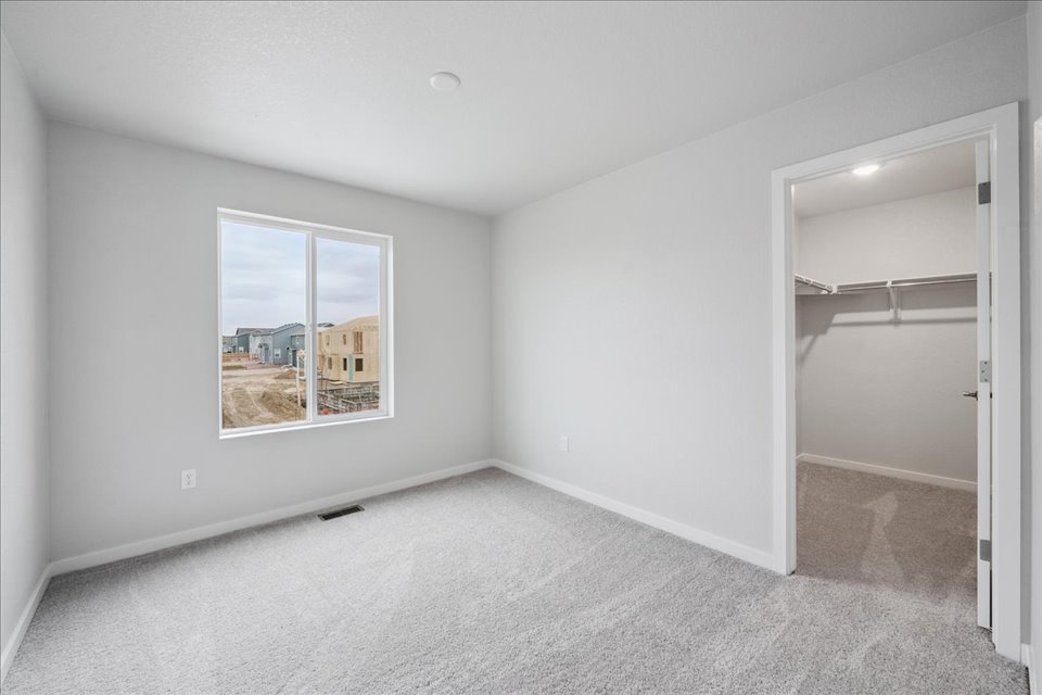 A room with a window and a door.