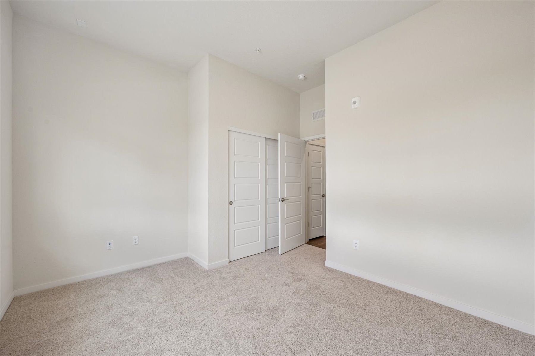 A room with white cabinets.
