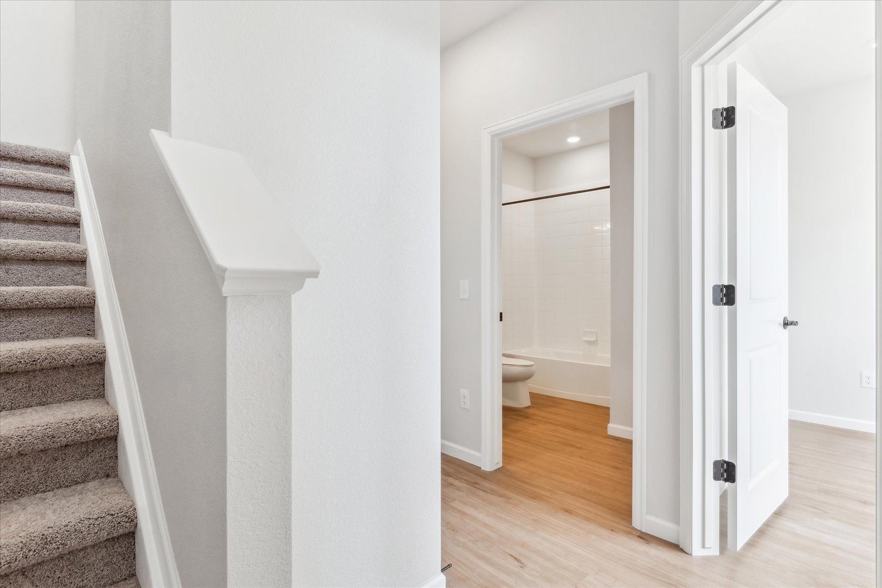 A bathroom with a toilet and a sink.