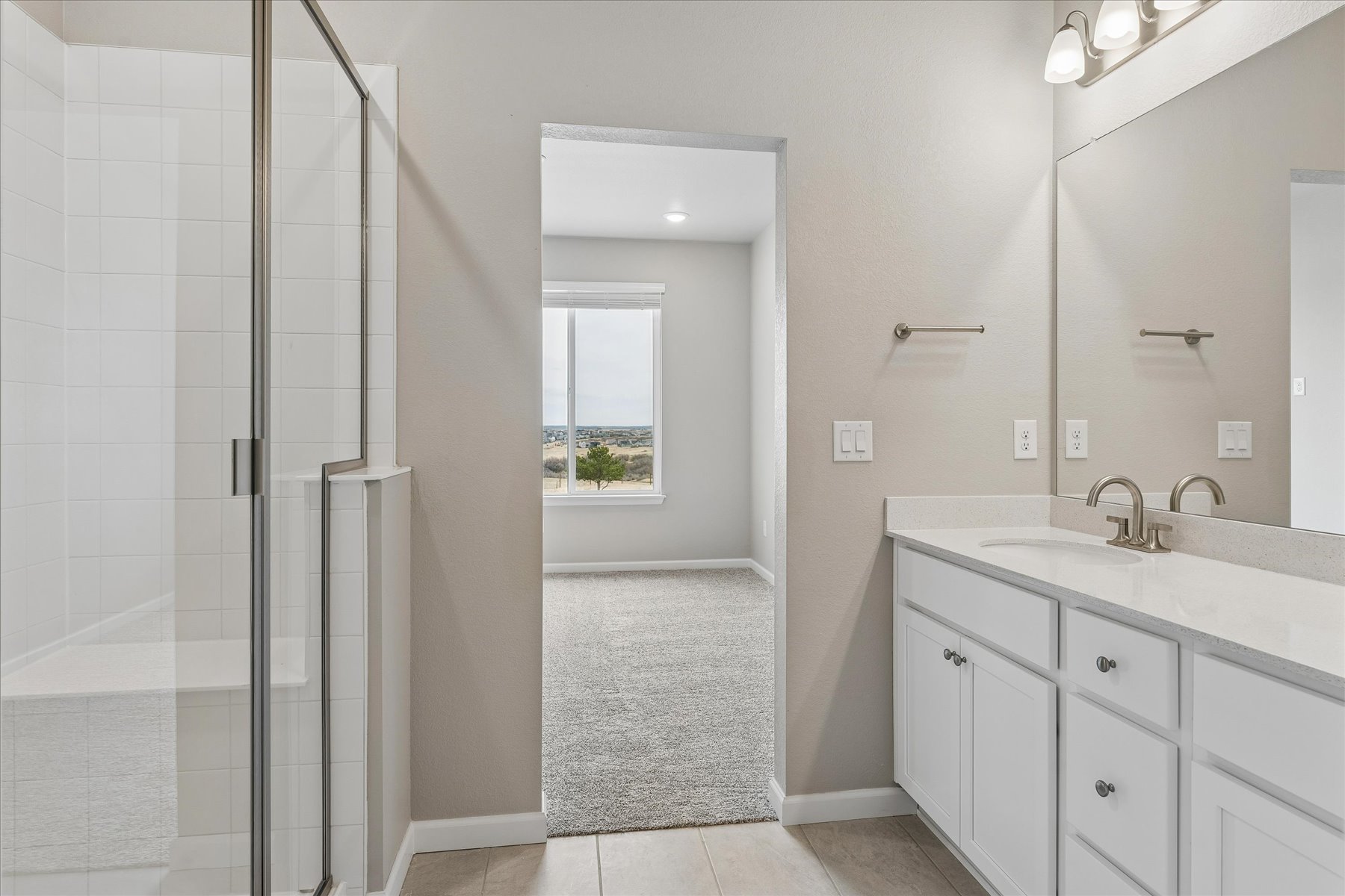 A bathroom with a glass shower.