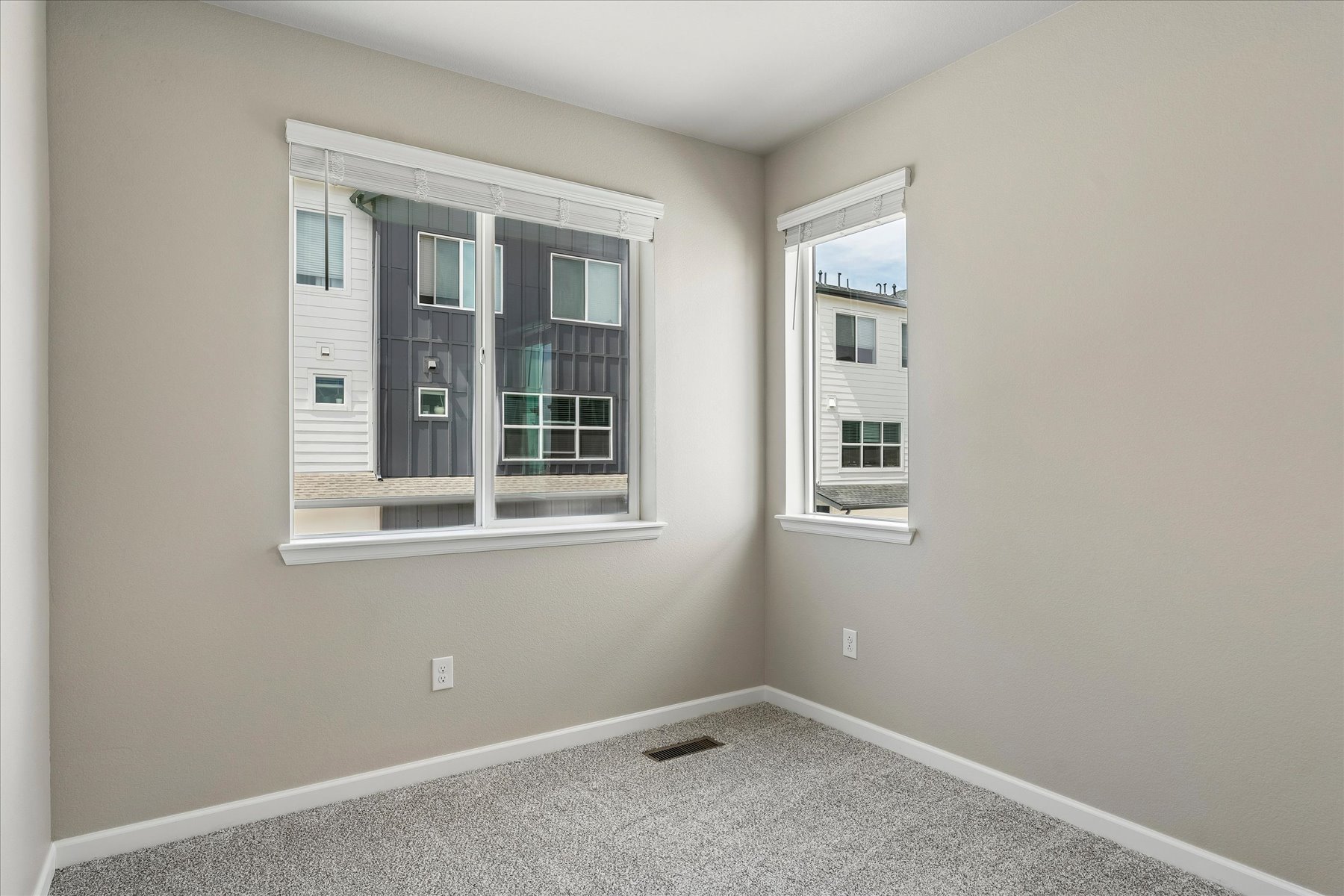 A room with a window and a door.