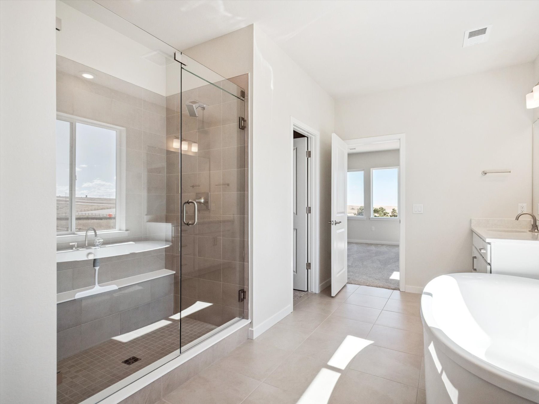A bathroom with a glass shower.