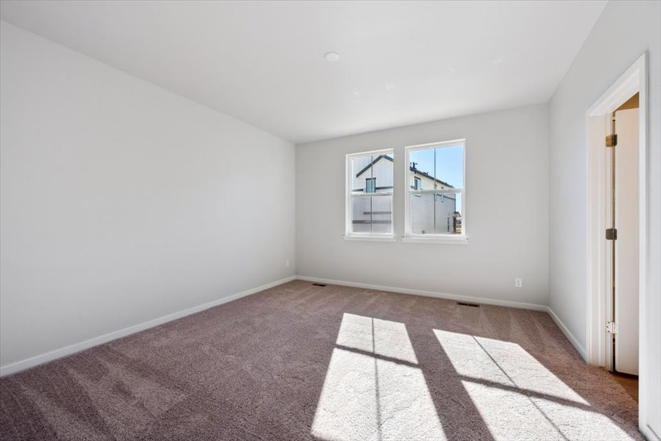 A room with a tile floor and a window.