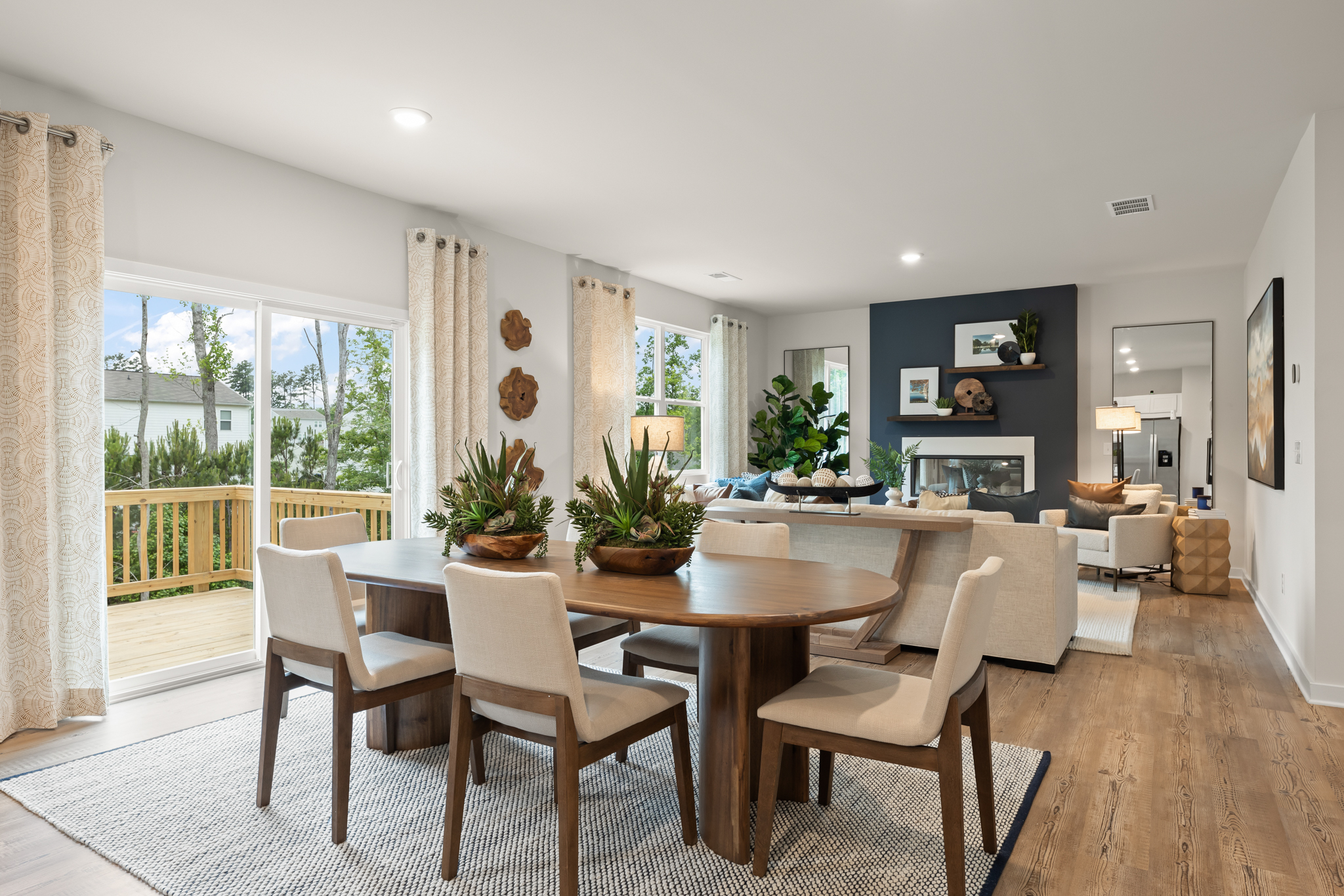 A dining room with a large table.