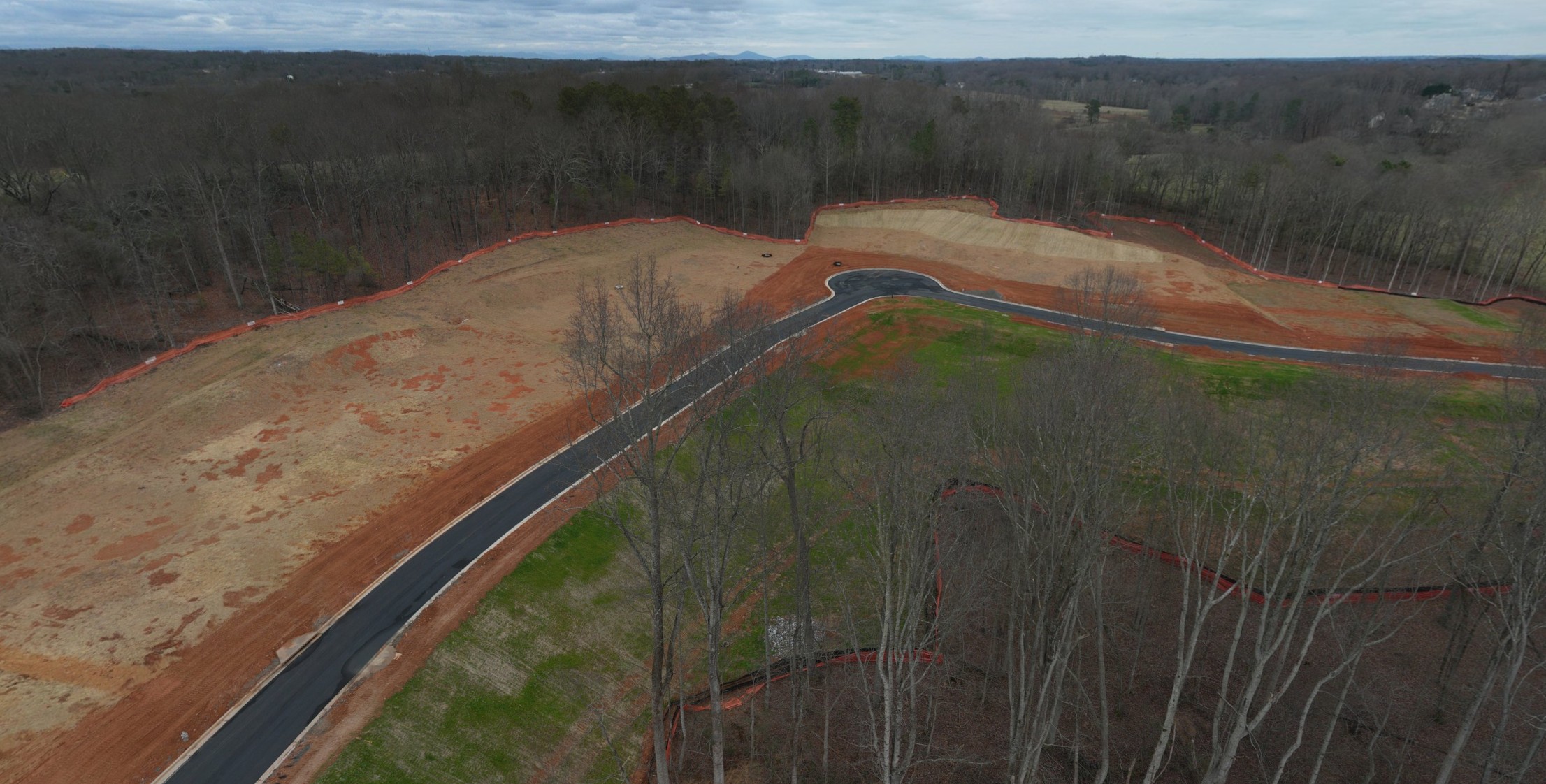 A road with trees on the side.