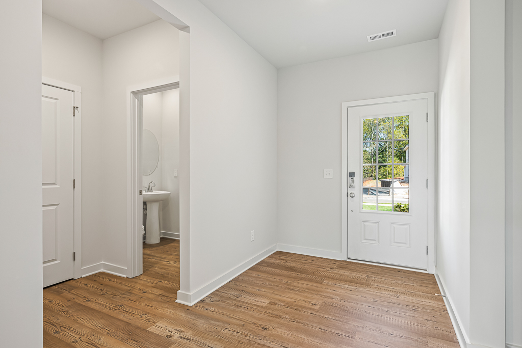 A bathroom with white walls.