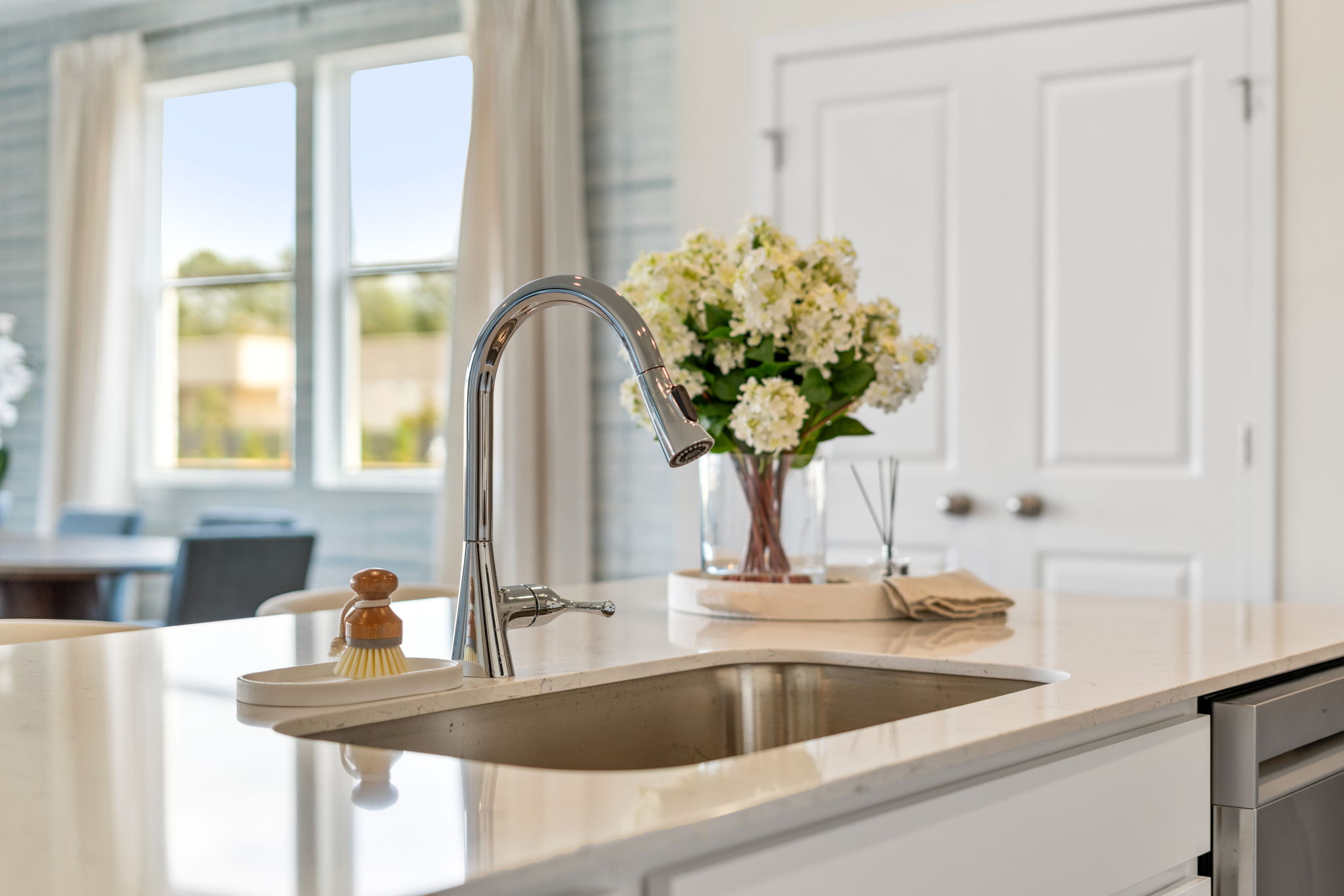 A sink with flowers in it.