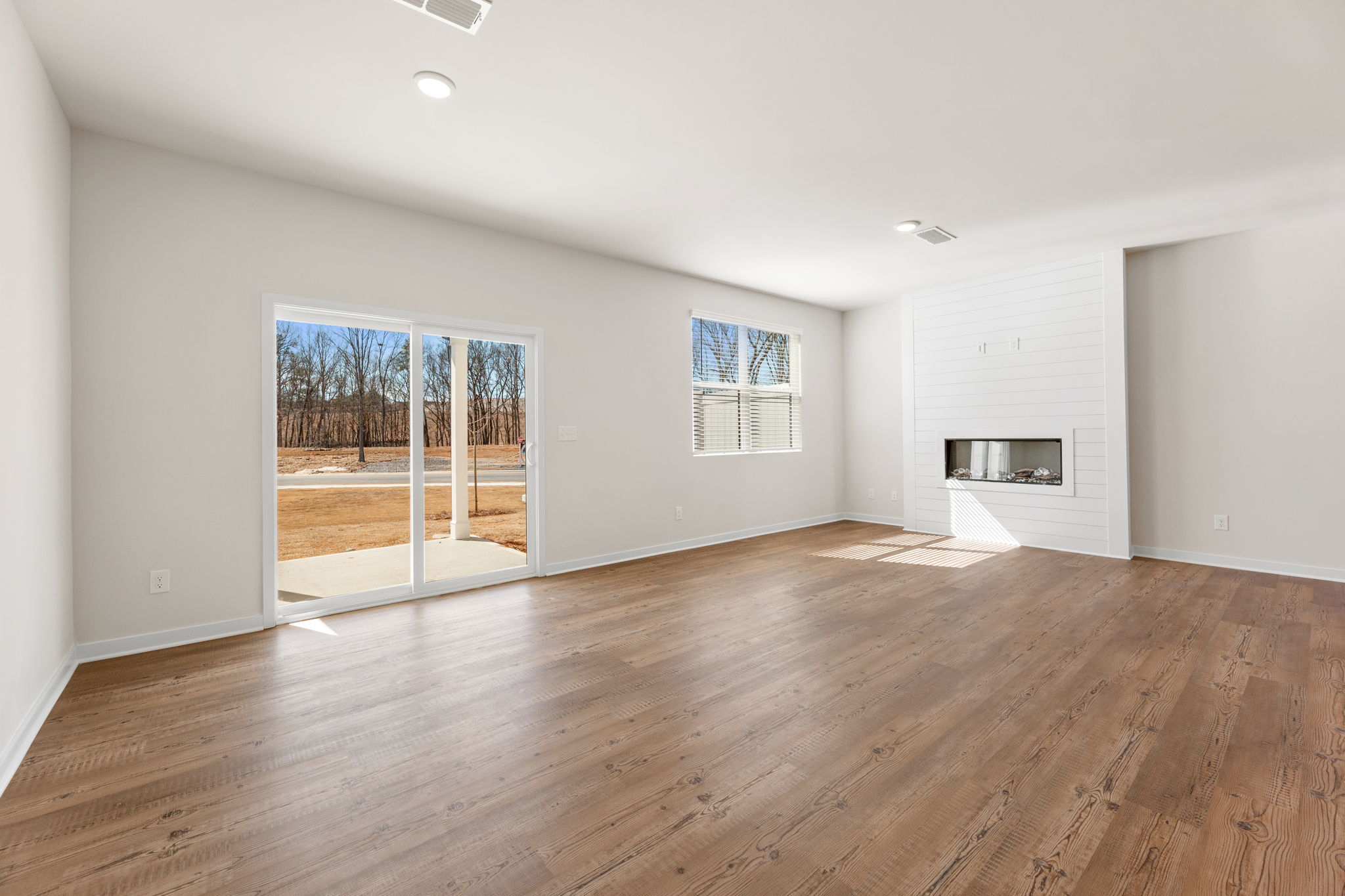 A room with a wood floor and a wood floor.