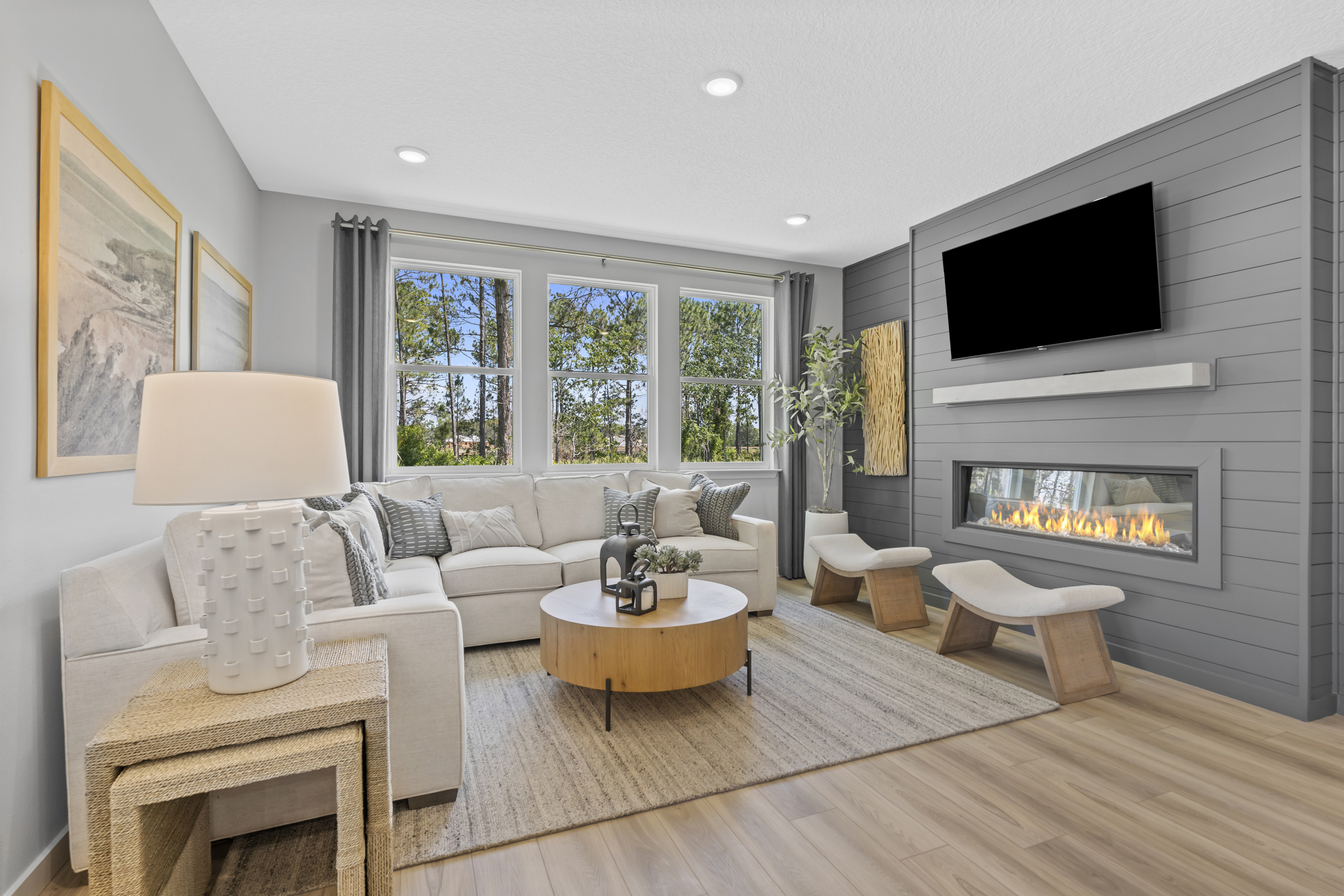 Coronado Model Home Living Room with Electric Fireplace at Reserve East in Flagler Beach