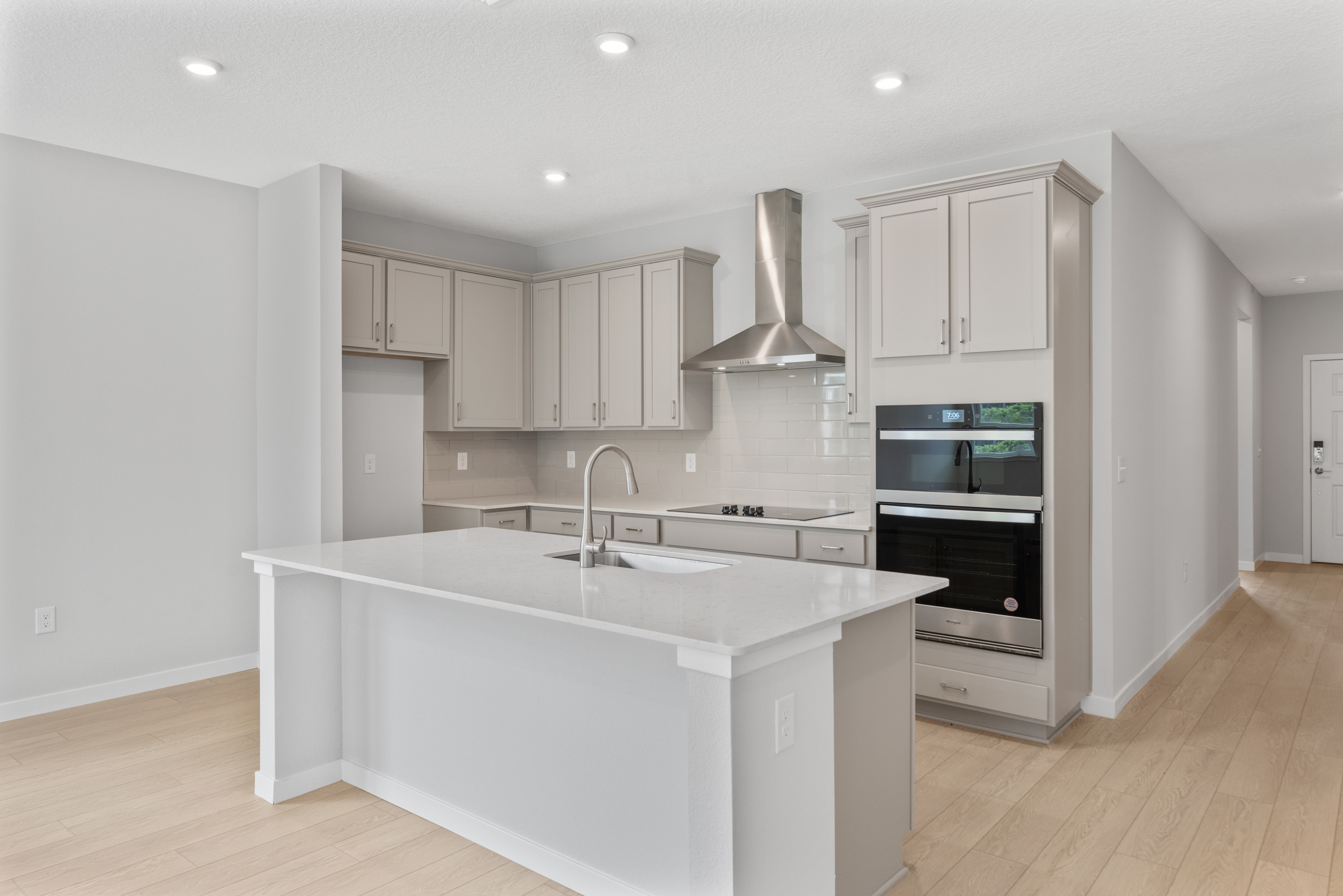 Charleston II Floorplan Lot 144 Chef's Kitchen with Gray Cabinets at Seminole Palms in Palm Coast