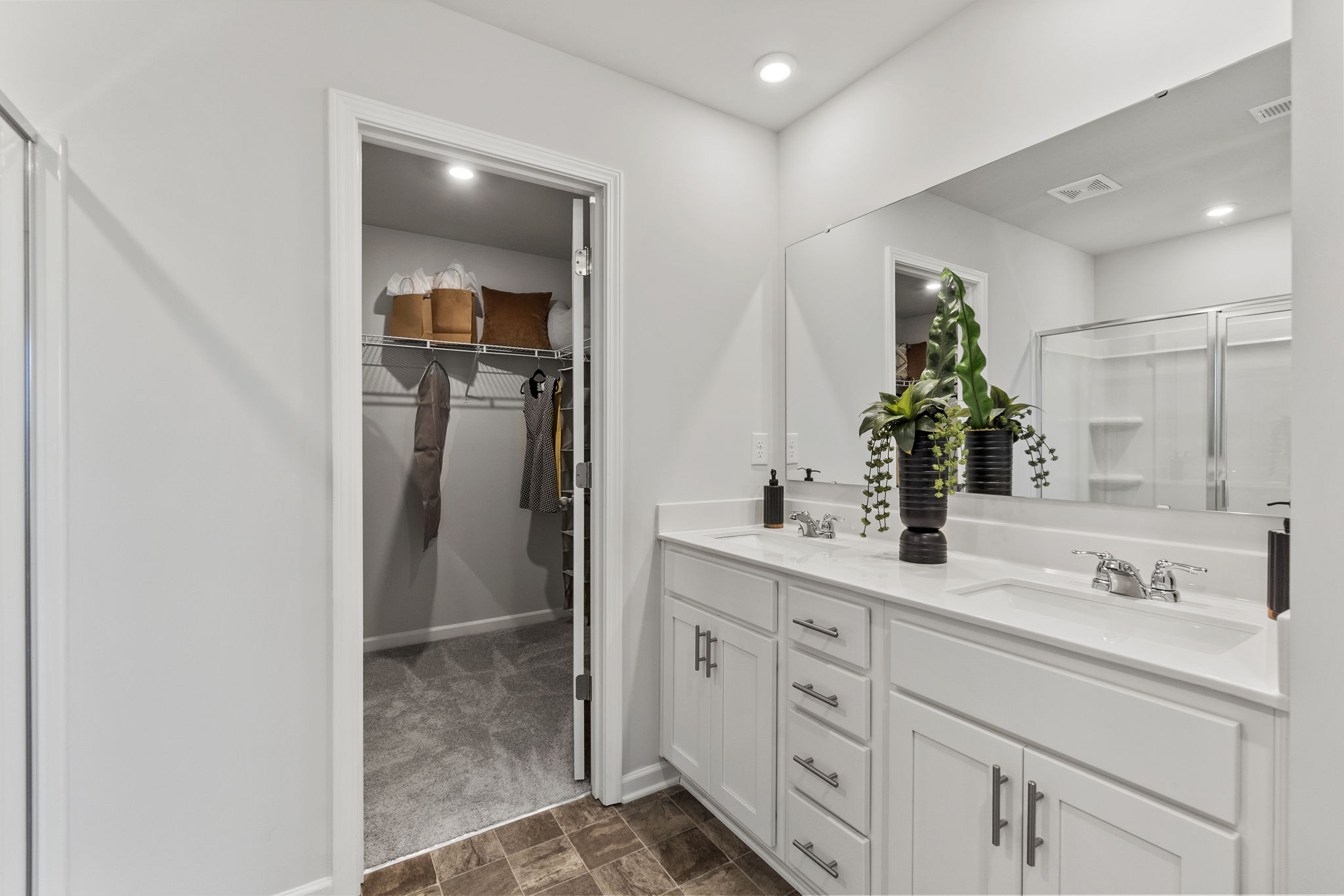 A bathroom with a glass shower.