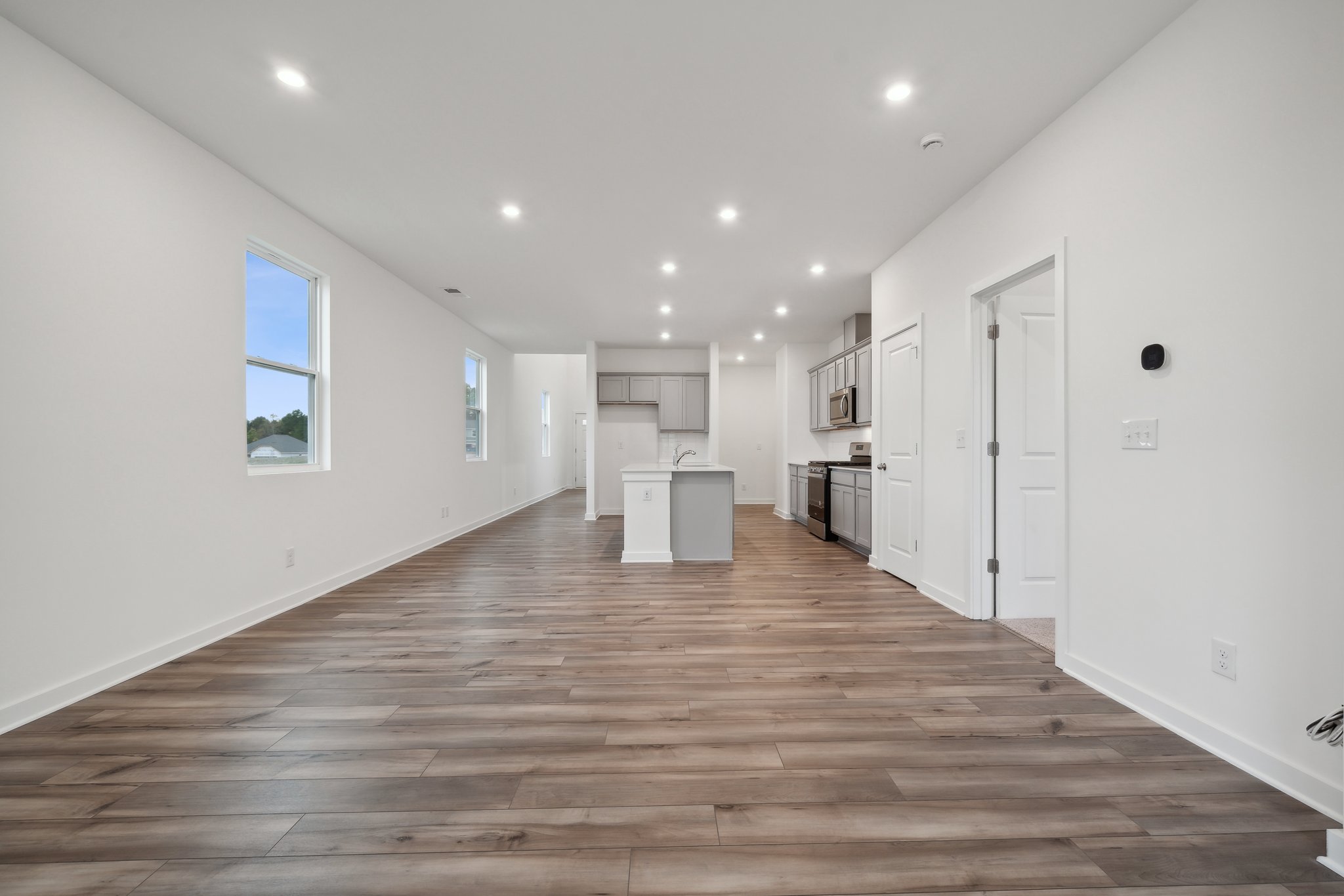 A long hallway with white walls.
