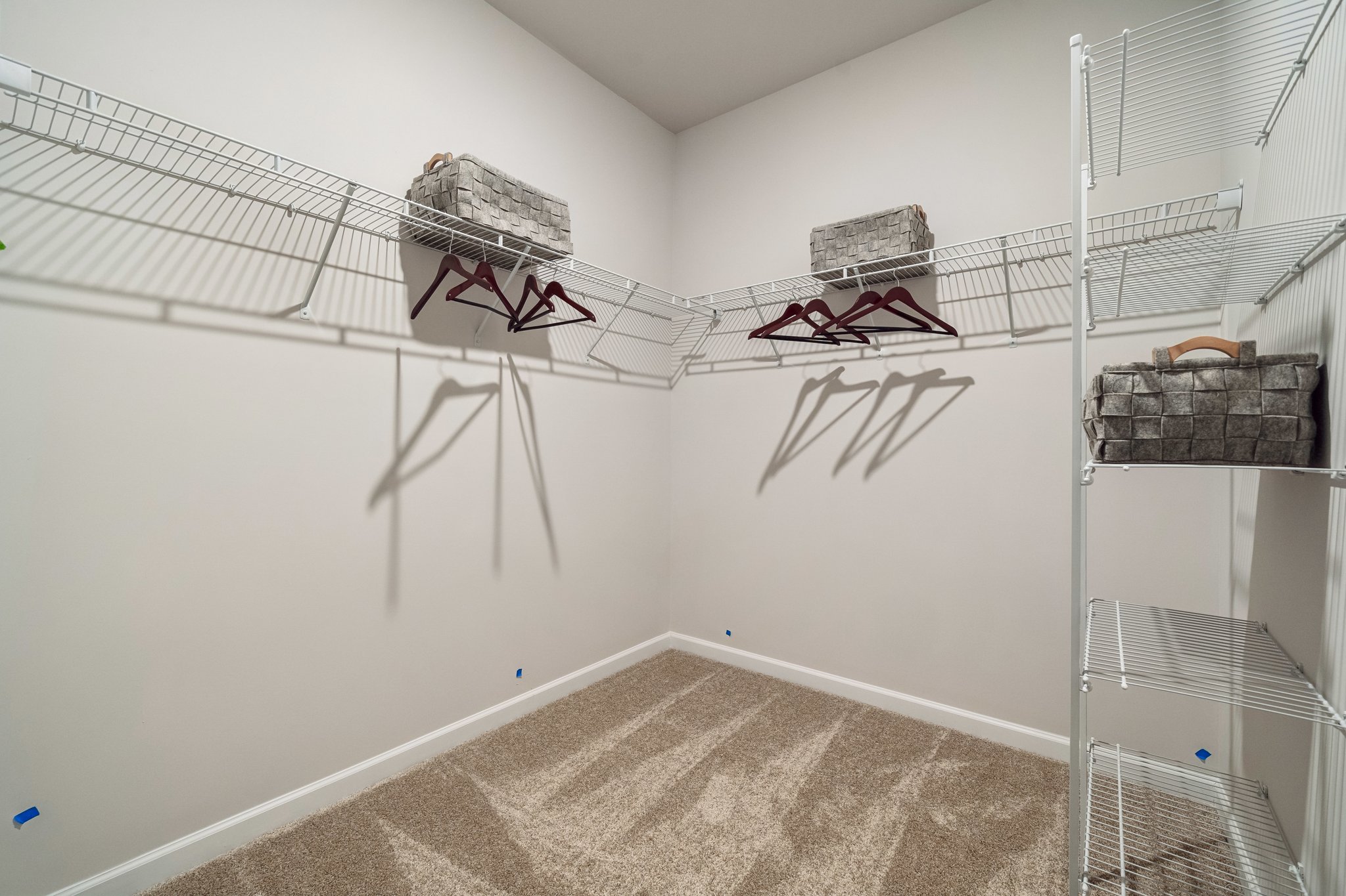 A room with a white wall with a white wall with a drawing on it.