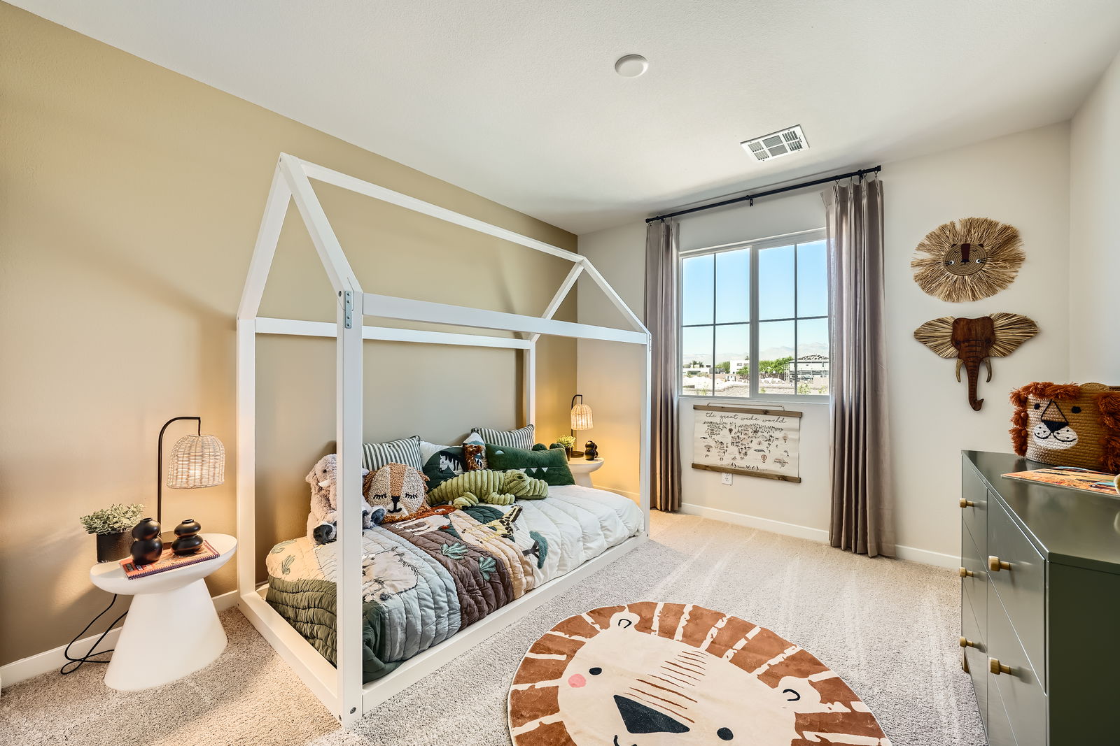 A bedroom with a bed and a large window.