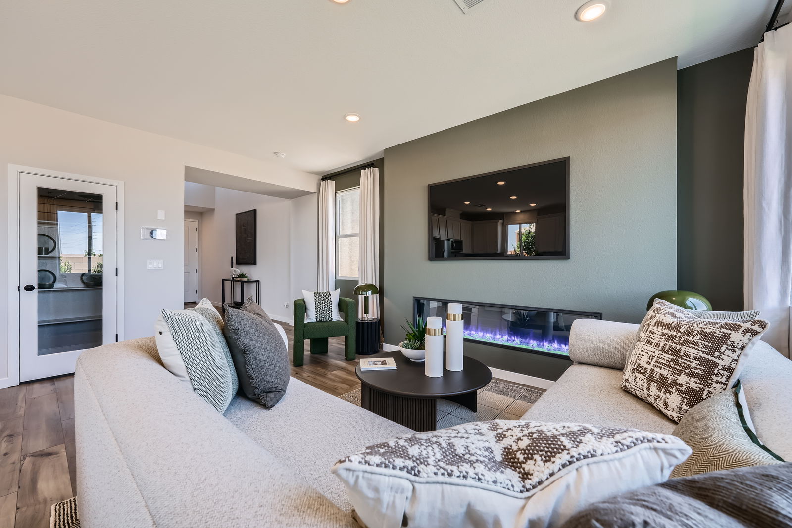 A living room with a large mirror.