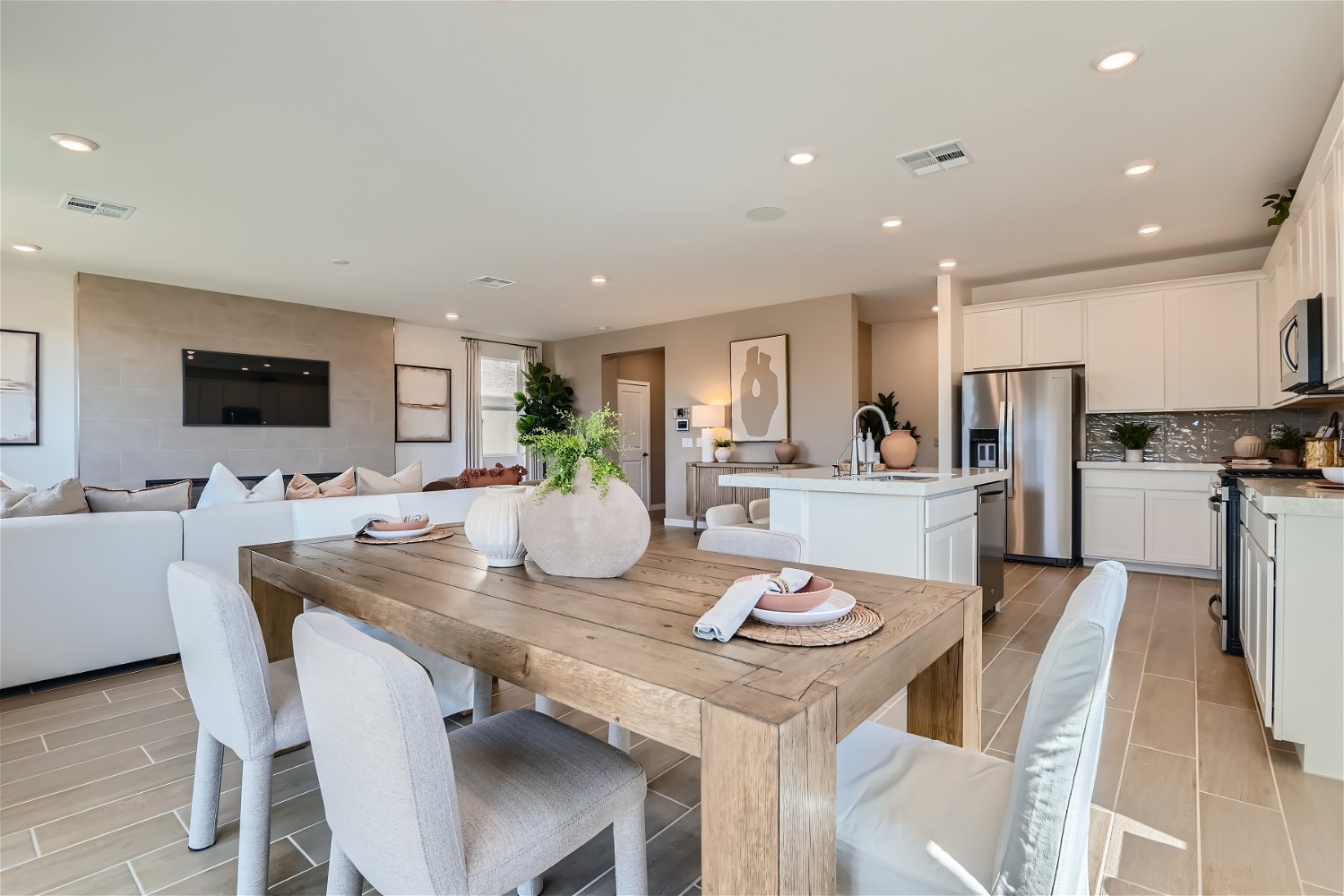 A kitchen with a dining table.