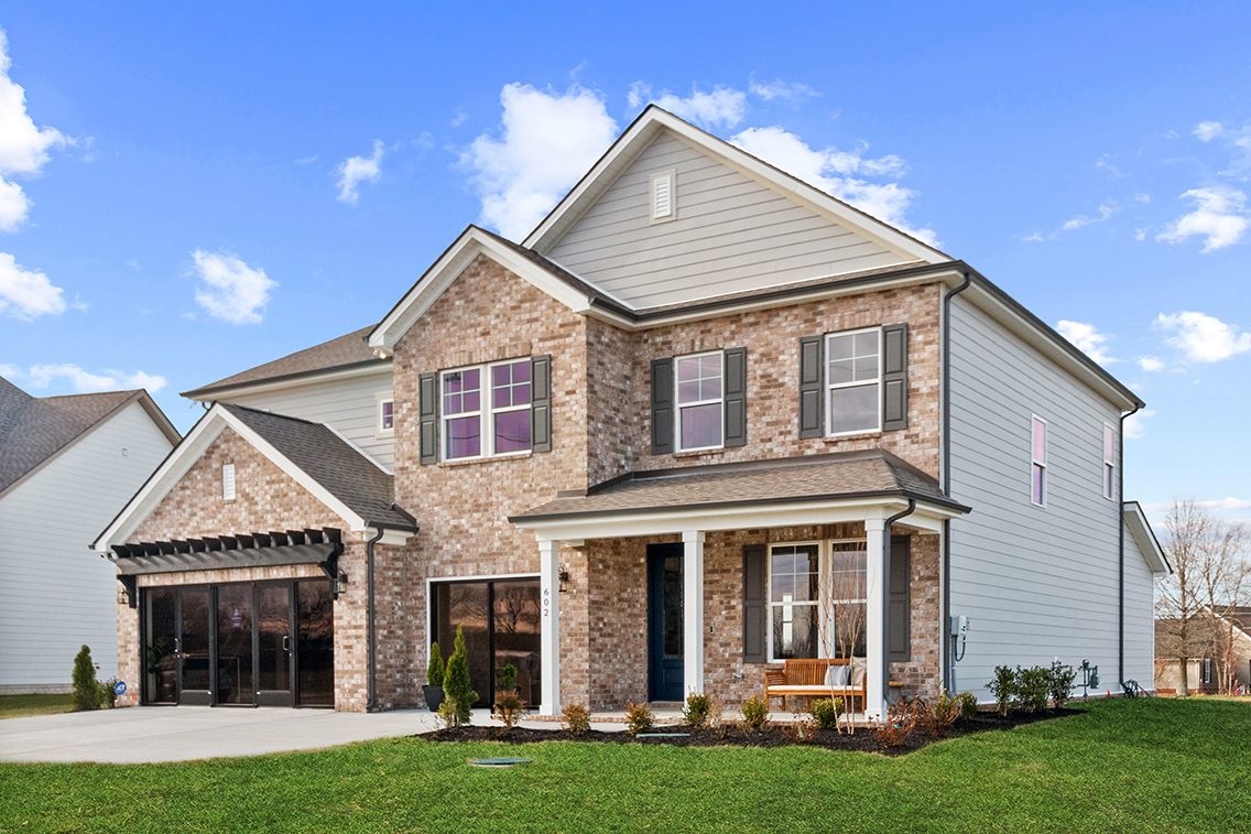 A house with a large front yard.