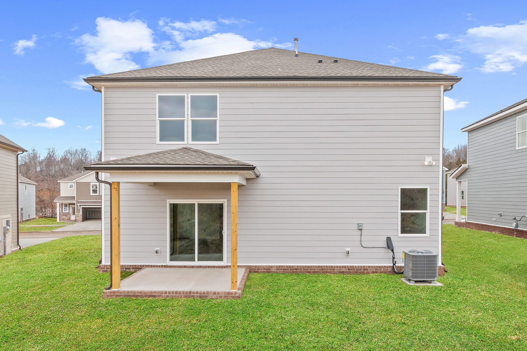 A small house with a small garage.