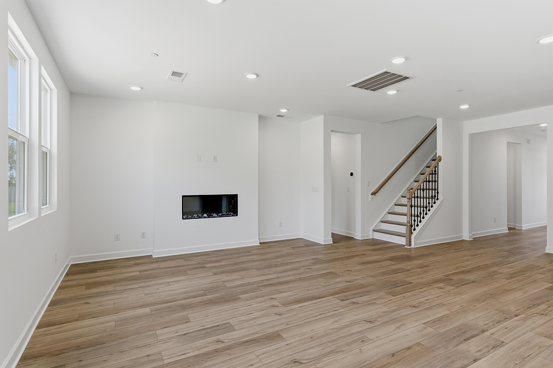 A room with a wood floor and a wood floor.