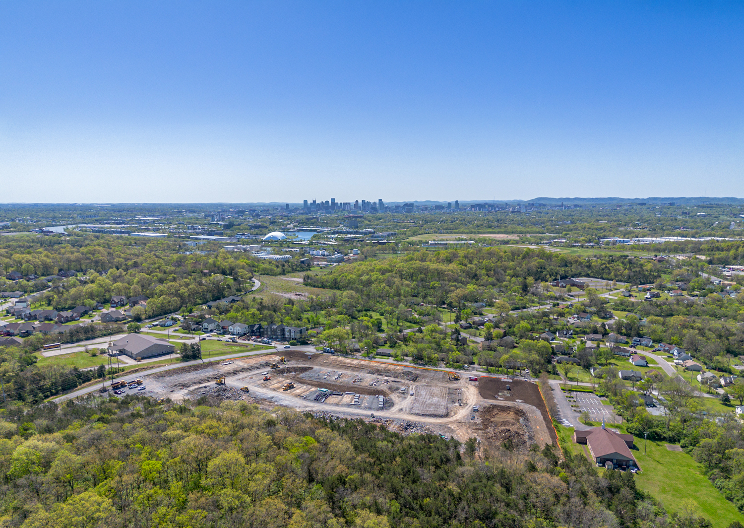 A landscape with trees and buildings.