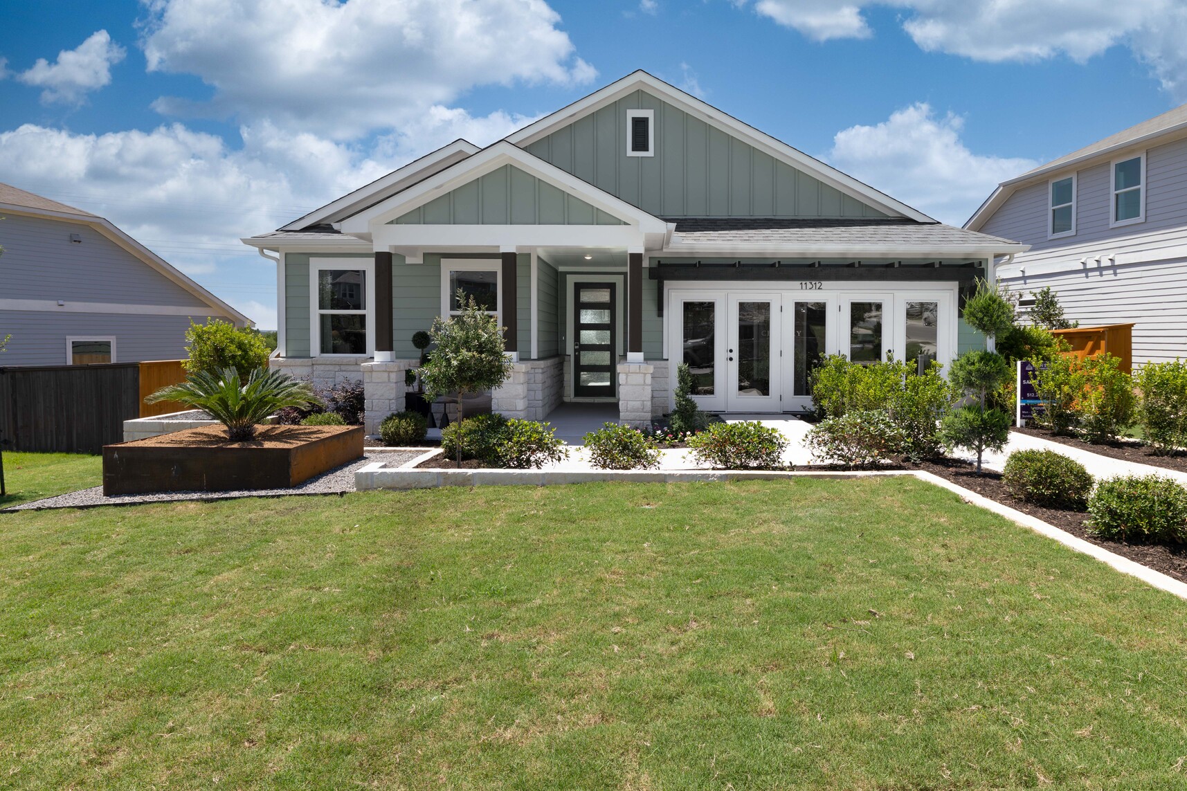 A house with a large front yard.