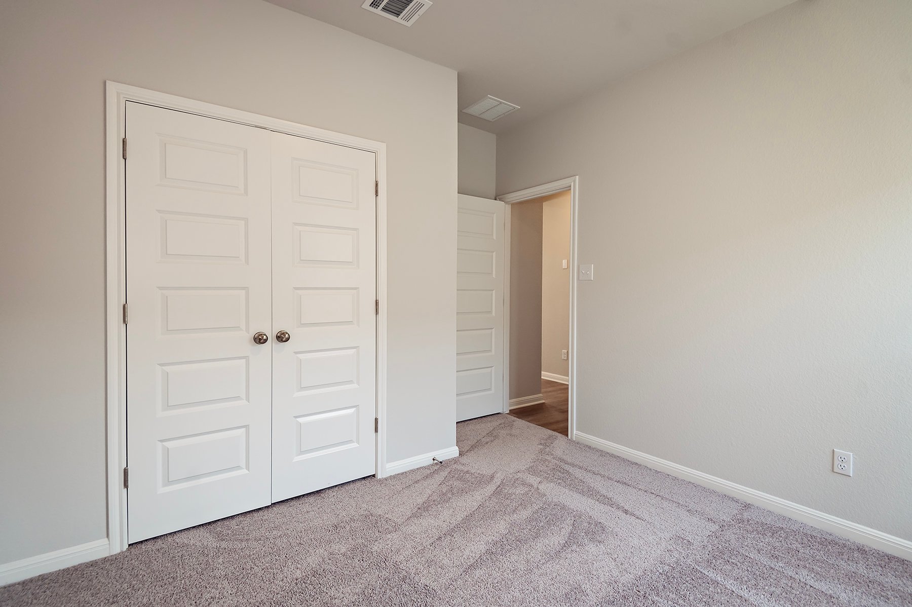 A room with white doors.
